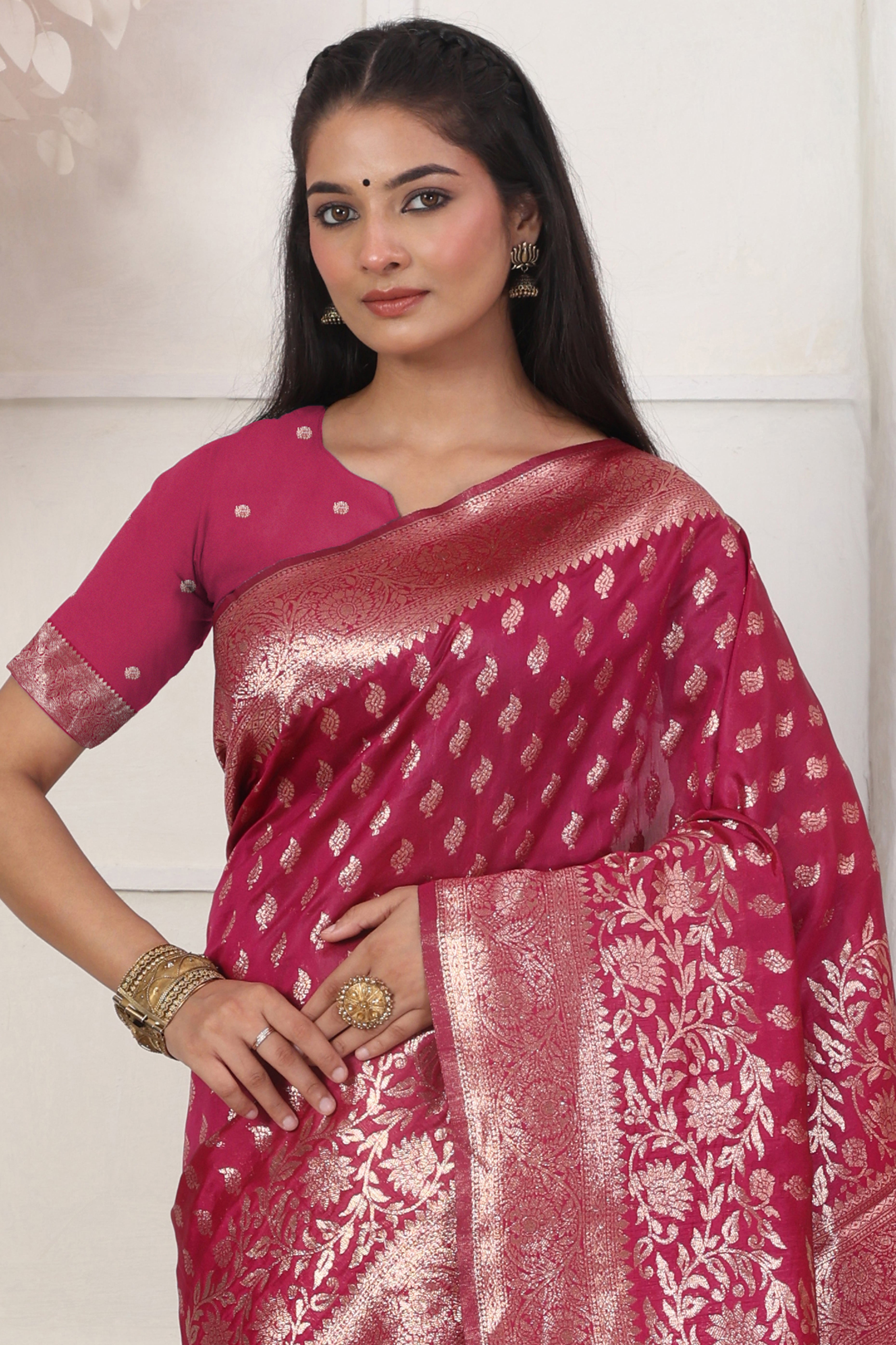 Pink Traditional Lichi Silk Blend Saree Enhanced With Floral Zari Weaving & Tassel Pallu