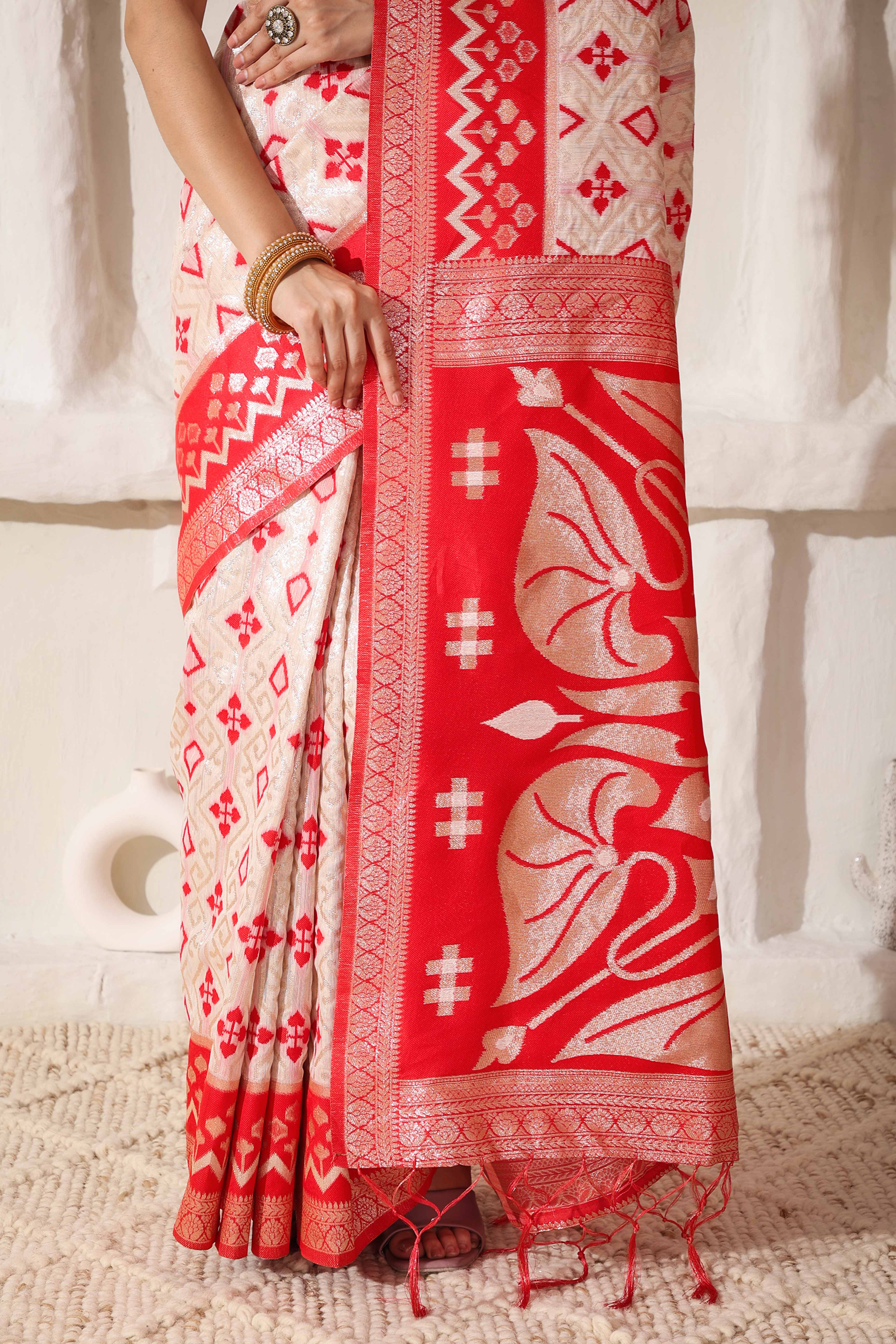 Graceful White & Red Saree In Linen Cotton With Fine Zari Weaving And Flowing Tassel Details