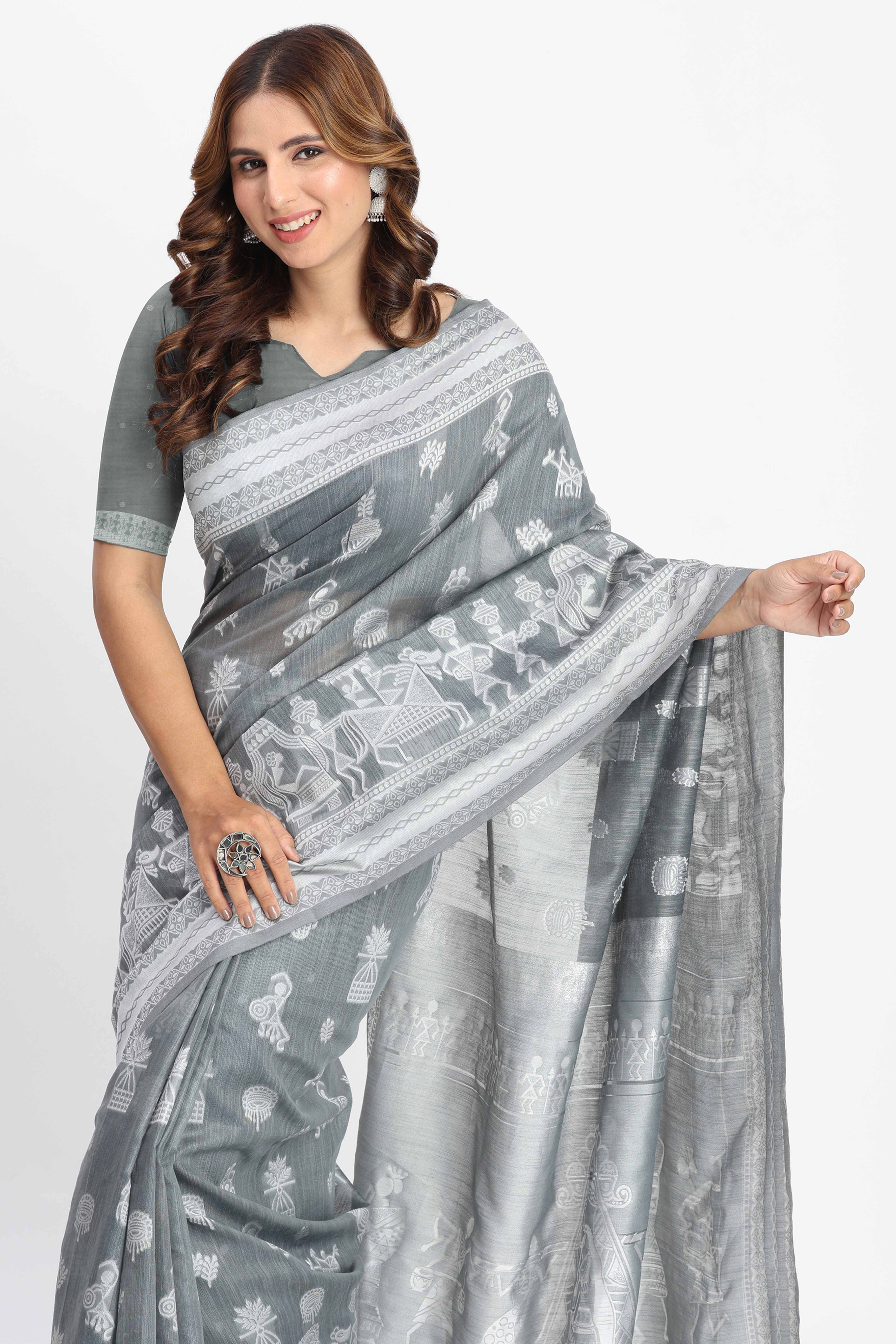 Grey Linen Cotton Saree Showcasing Traditional Warli Motifs In Zari Weaving With Tassel Pallu