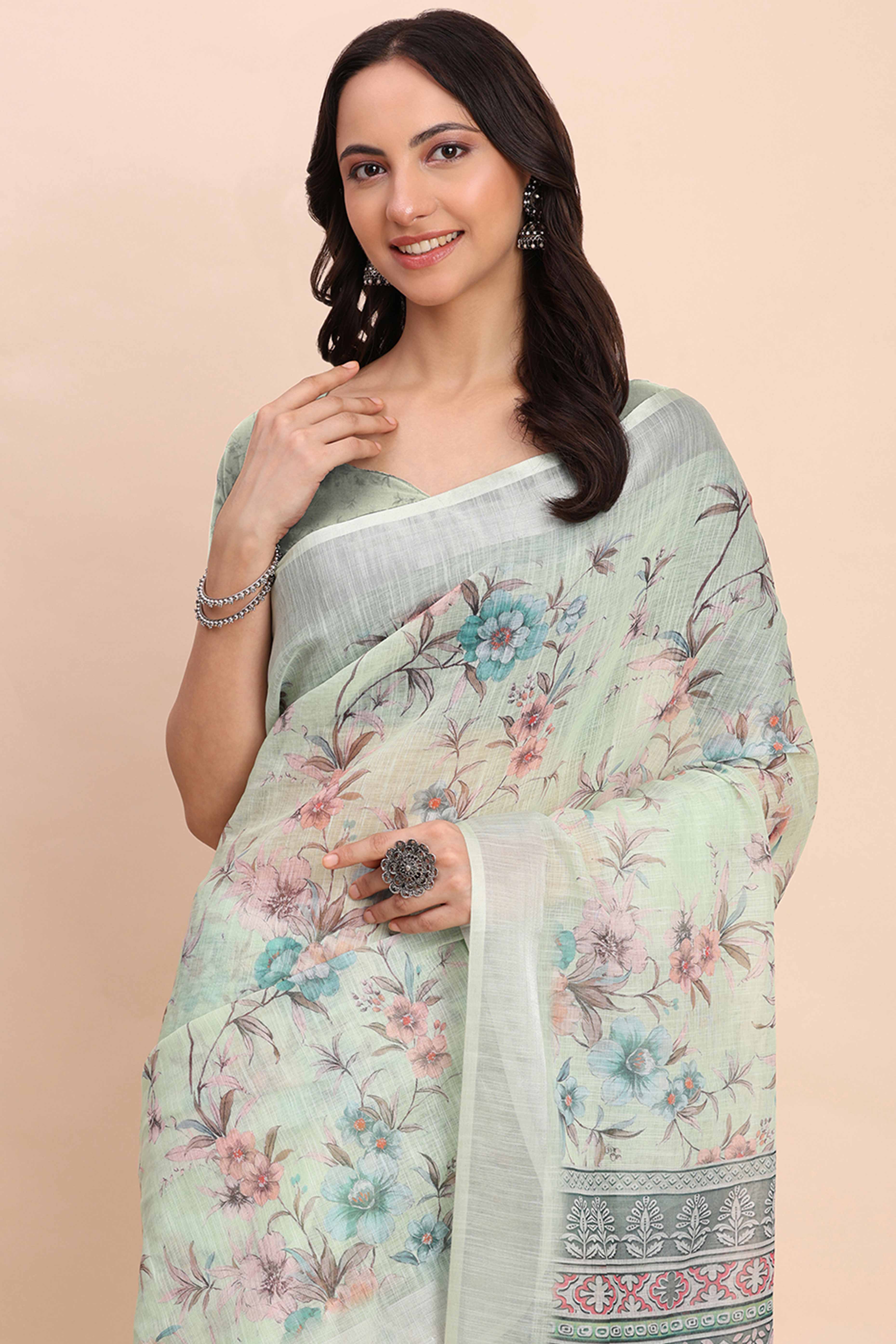 Light Green Linen Cotton Saree Featuring Floral Prints & Woven Border