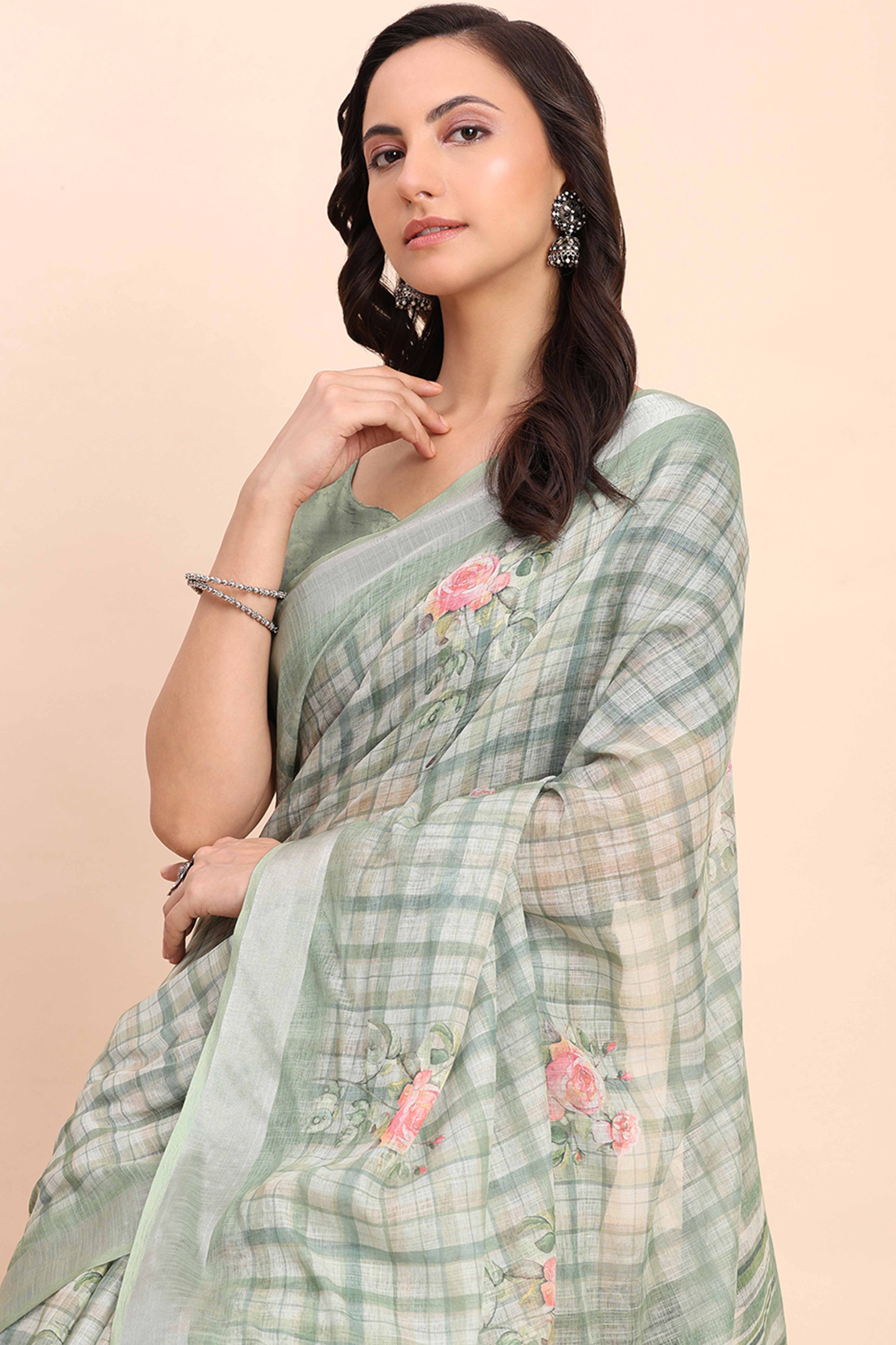 Sea Green Linen Cotton Saree Featuring Floral Prints & Woven Border