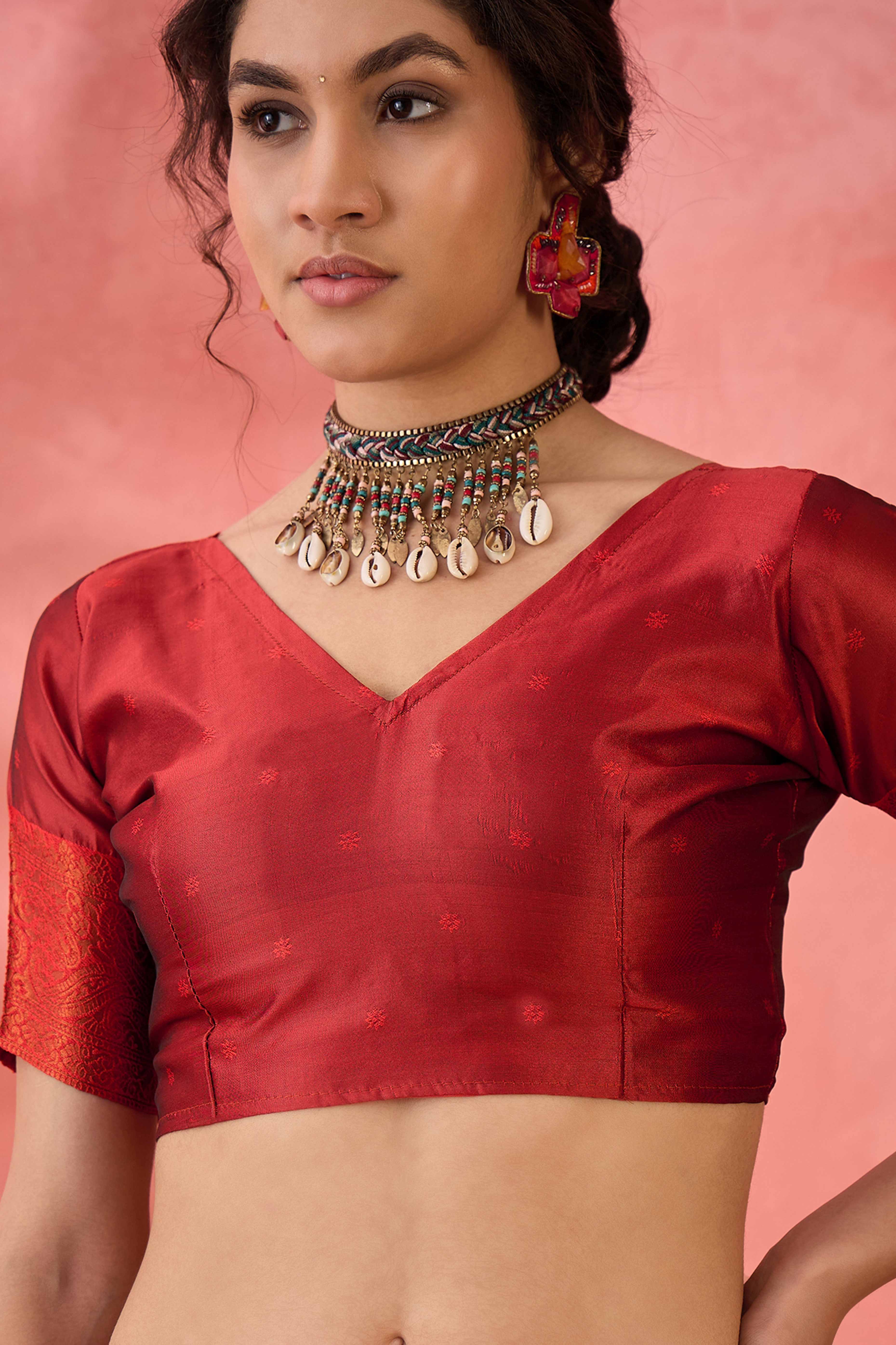 Rust Woven Poly Silk Blend Saree Featuring Floral & Paisley Motifs With Tassel Accents