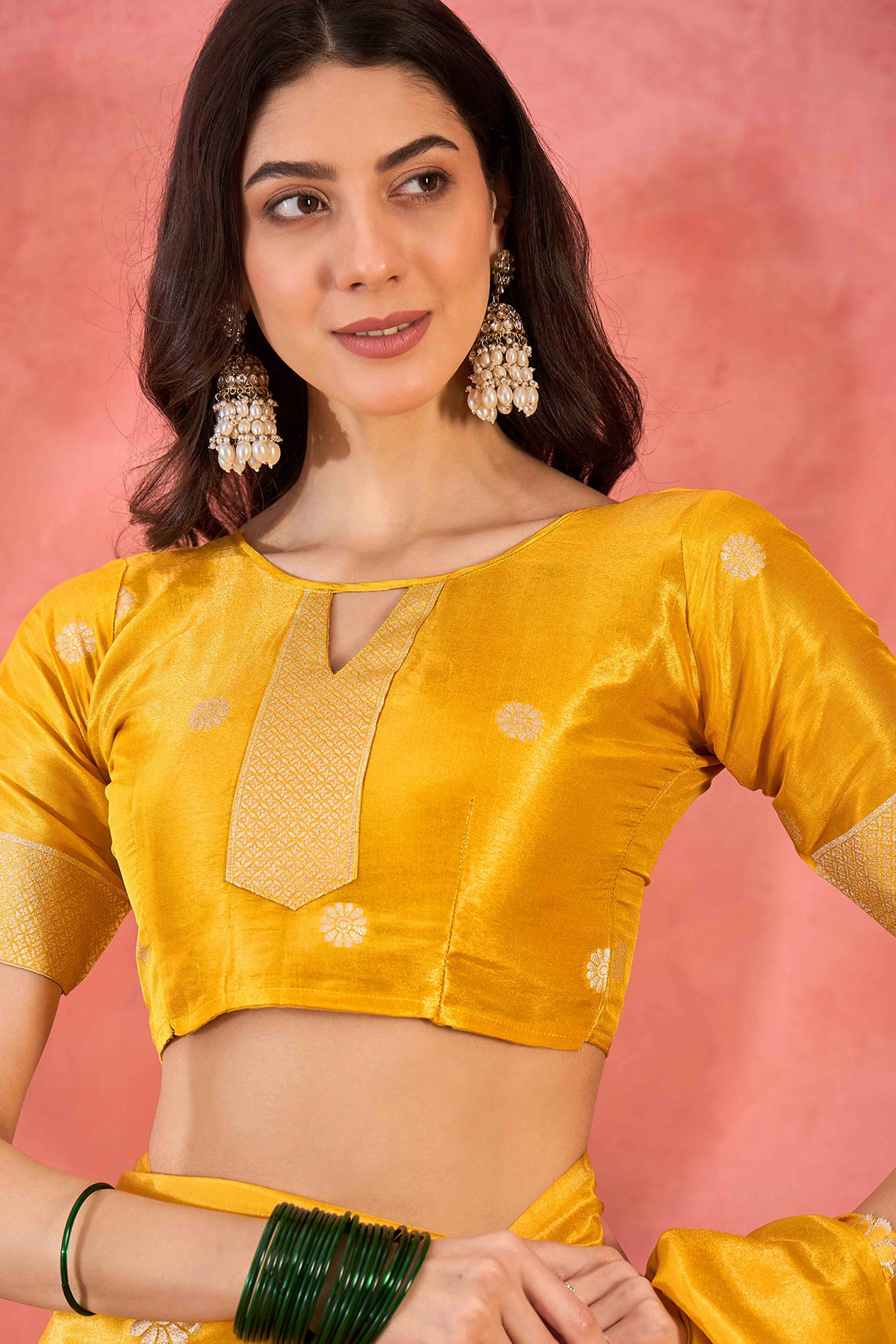 Yellow Shimmer Saree Adorned with Floral Zari Weaving & Tassel Pallu