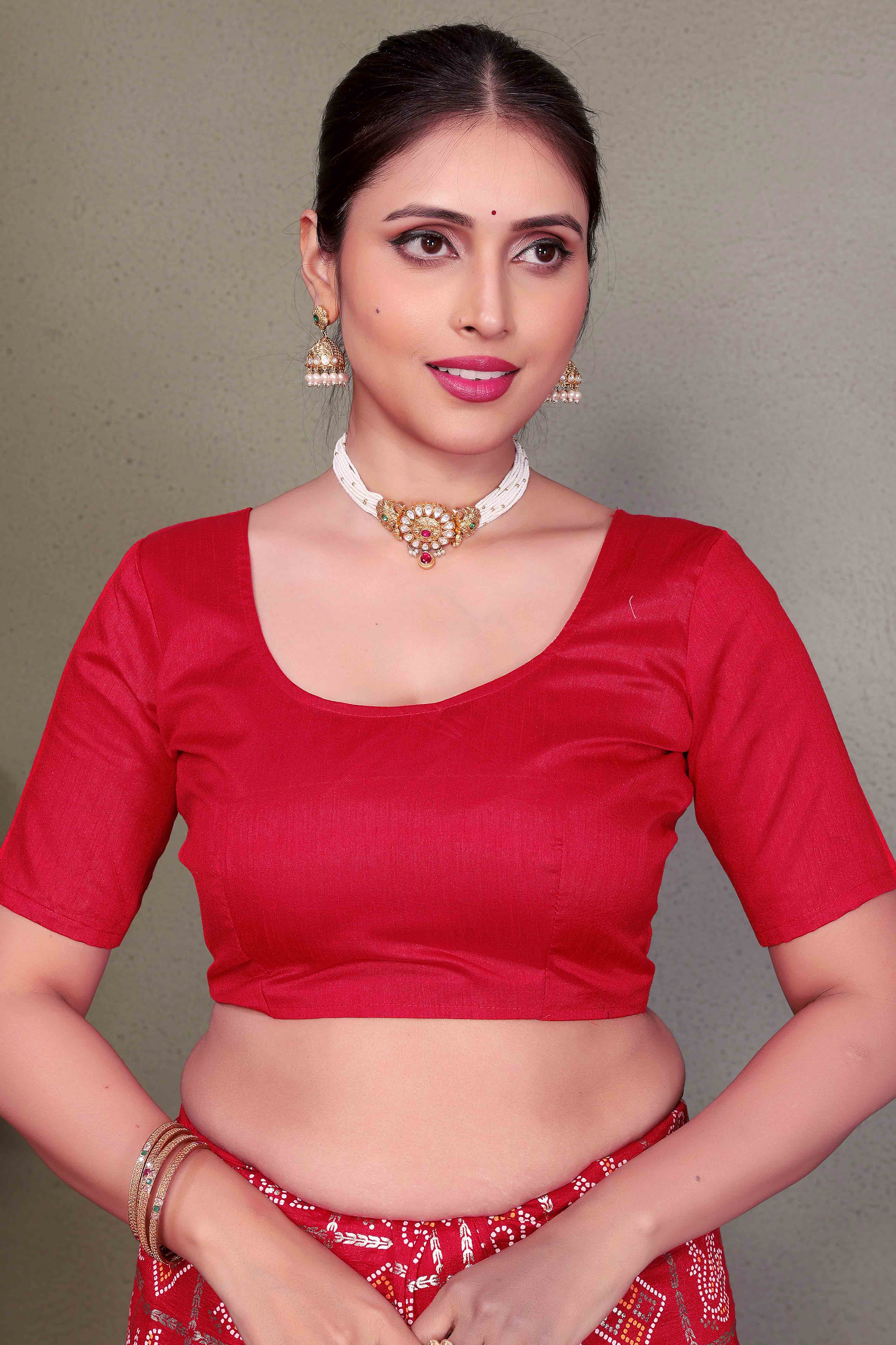 Red Vichitra Silk Saree Featuring Bandhani Patterns and Graceful Embroidered Borders