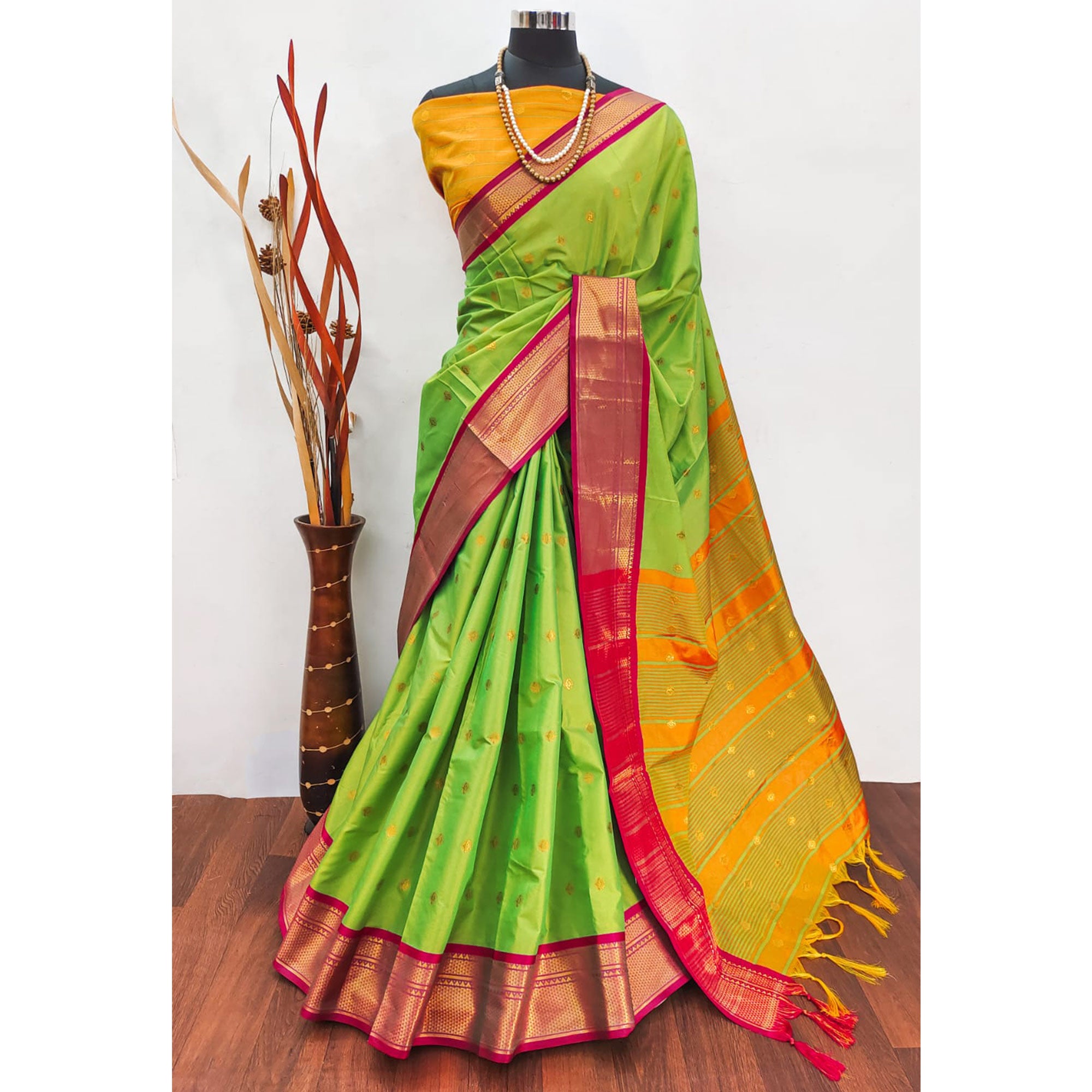 Green Zari Woven Lichi Art Silk Saree With Tassels