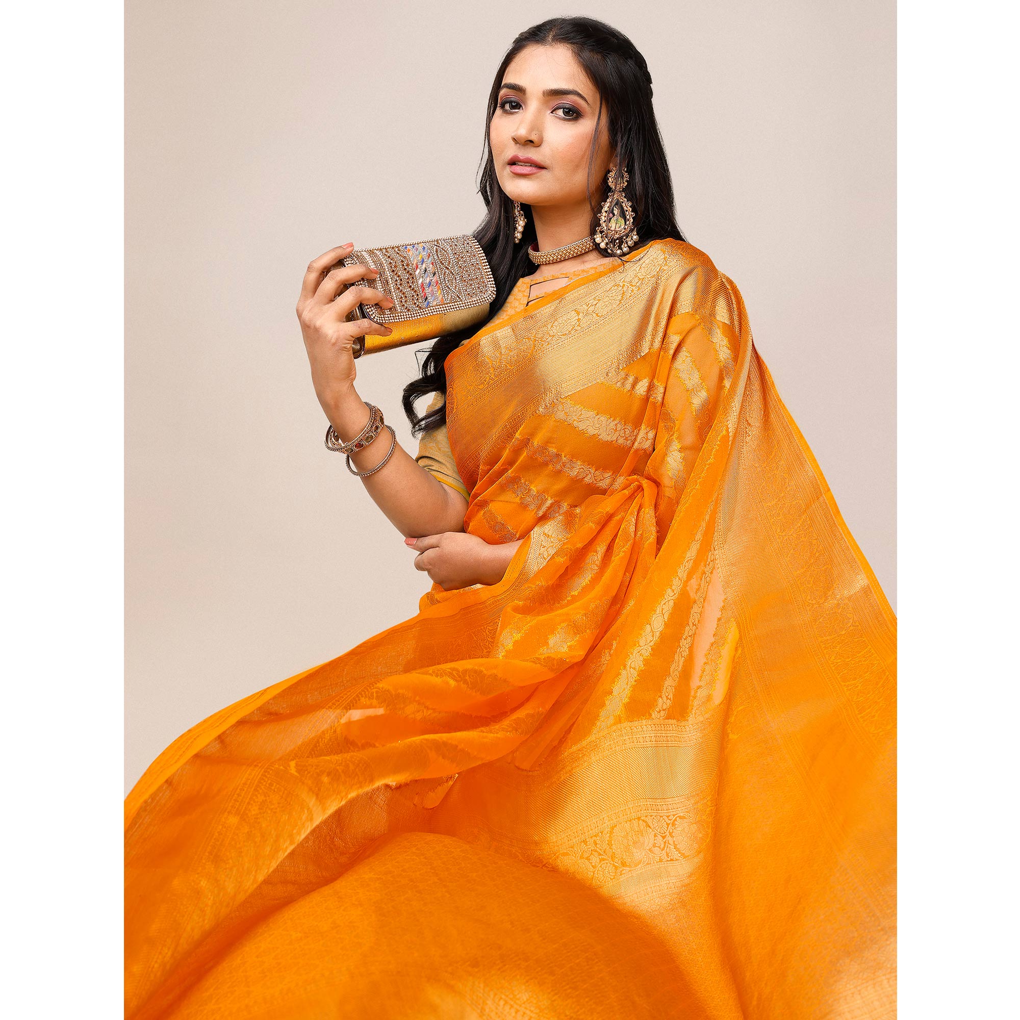Orange Woven Organza Saree With Tassels