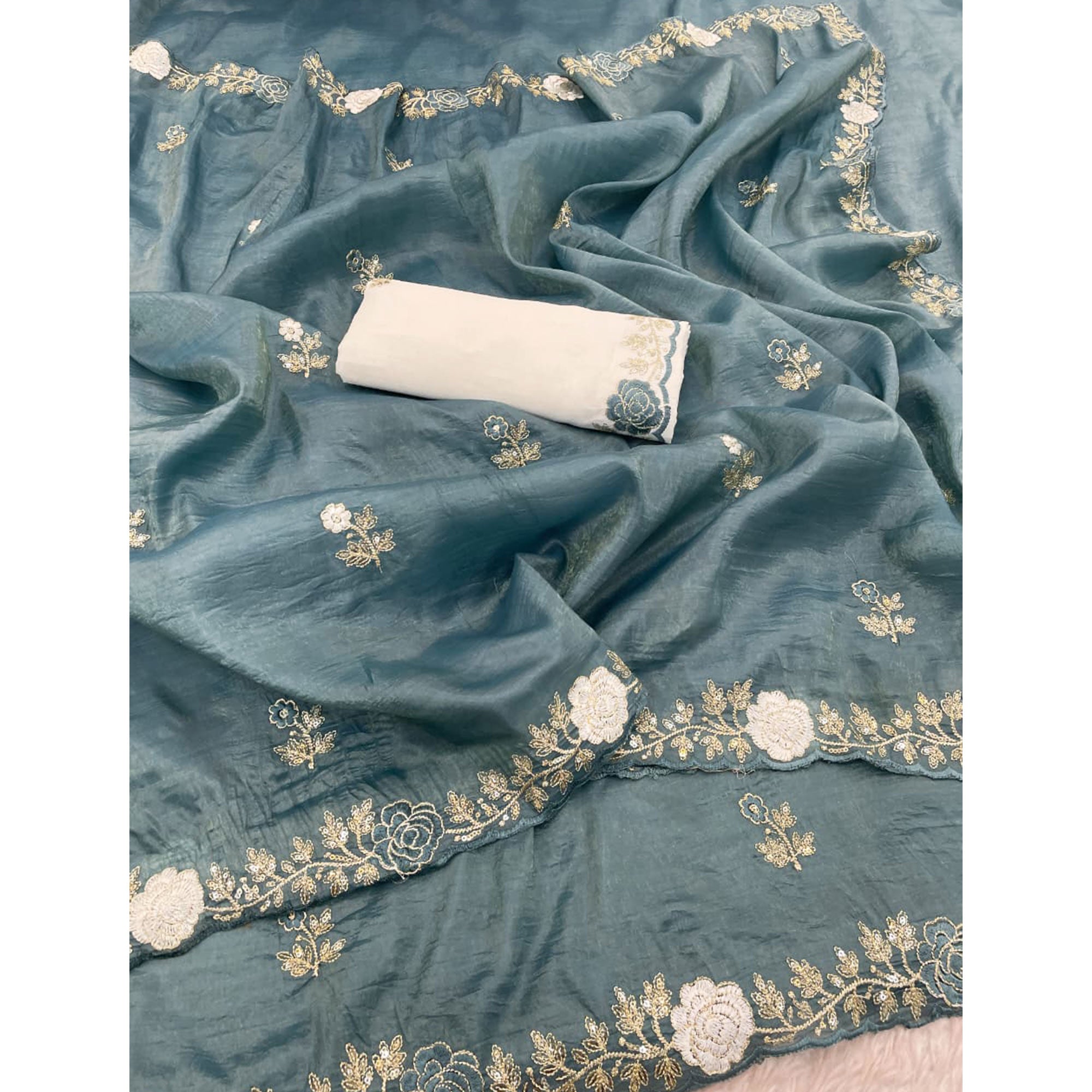 Blue Lightweight Georgette Crush Saree Adorned with Delicate Floral Embroidery