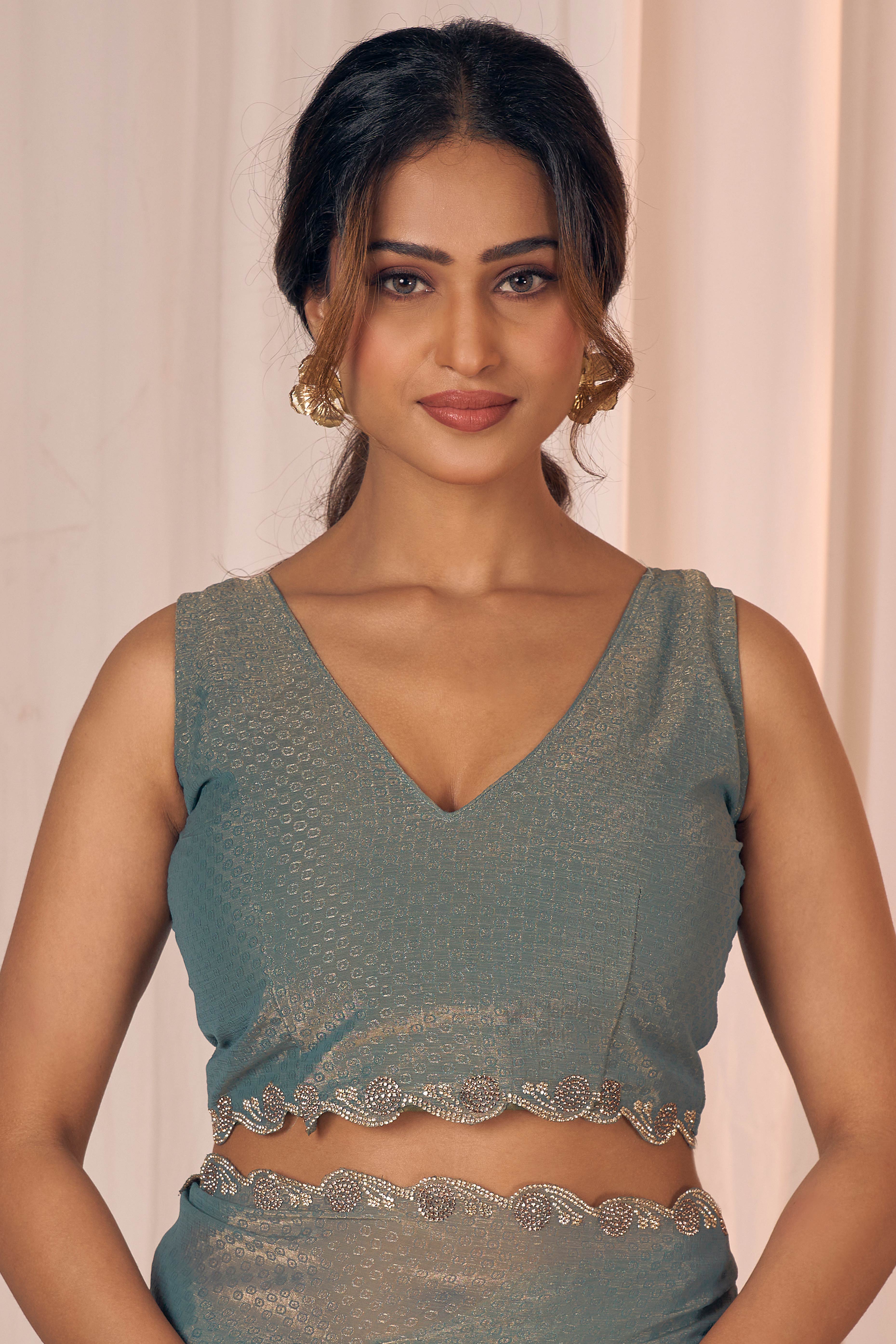 Designer Sage Green Georgette Saree Adorned With An Elegant Zarkan Cutwork Border