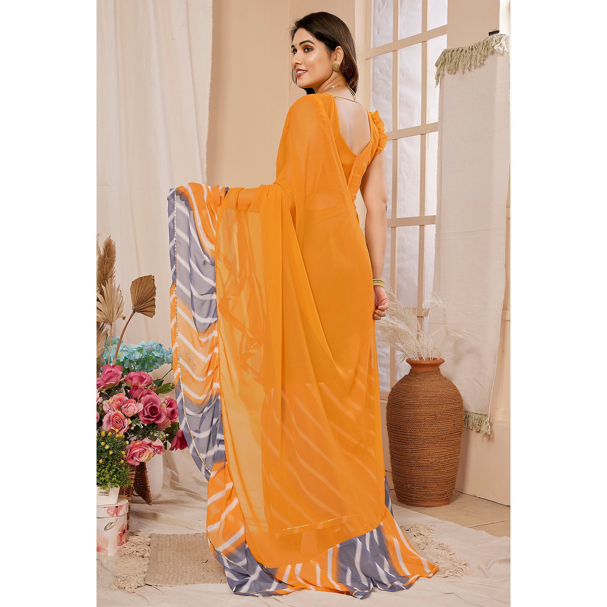 Orange Solid Georgette Saree With Printed Ruffle Border