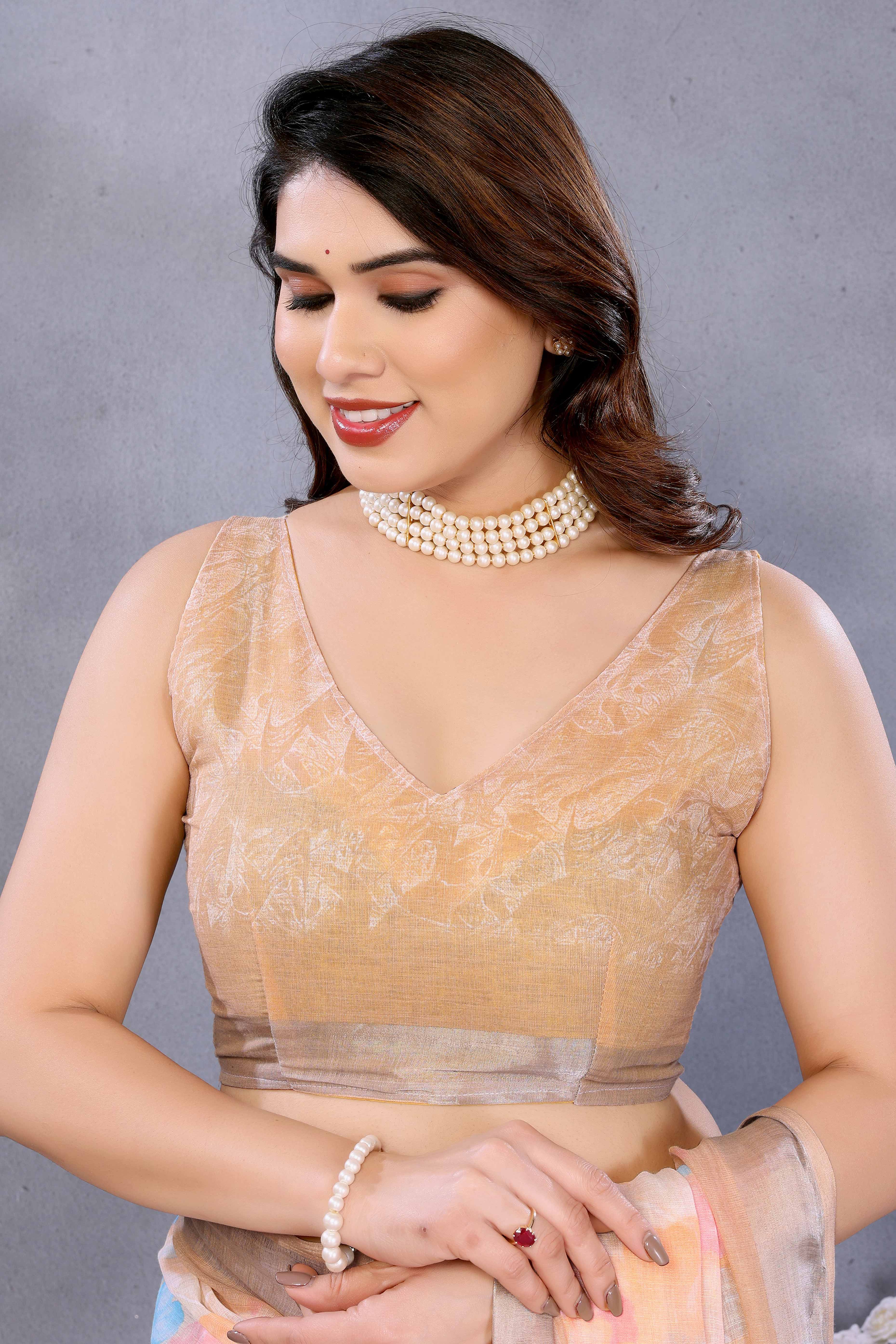 Orange Floral Printed Linen Saree Accented With A Classic Patta Border