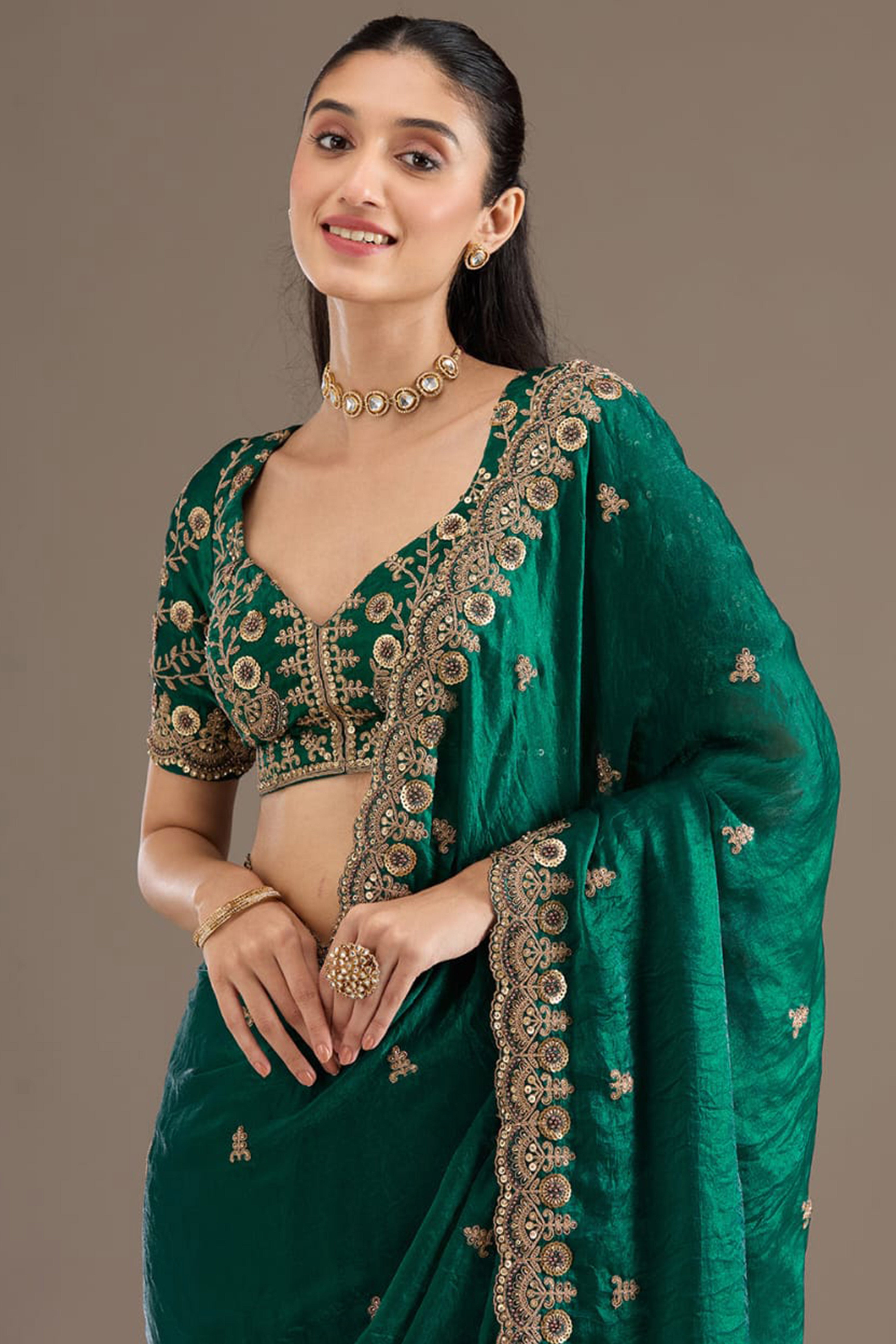 Trendy Green Fancy Satin Saree Enhanced With Rich Golden Embroidered Design