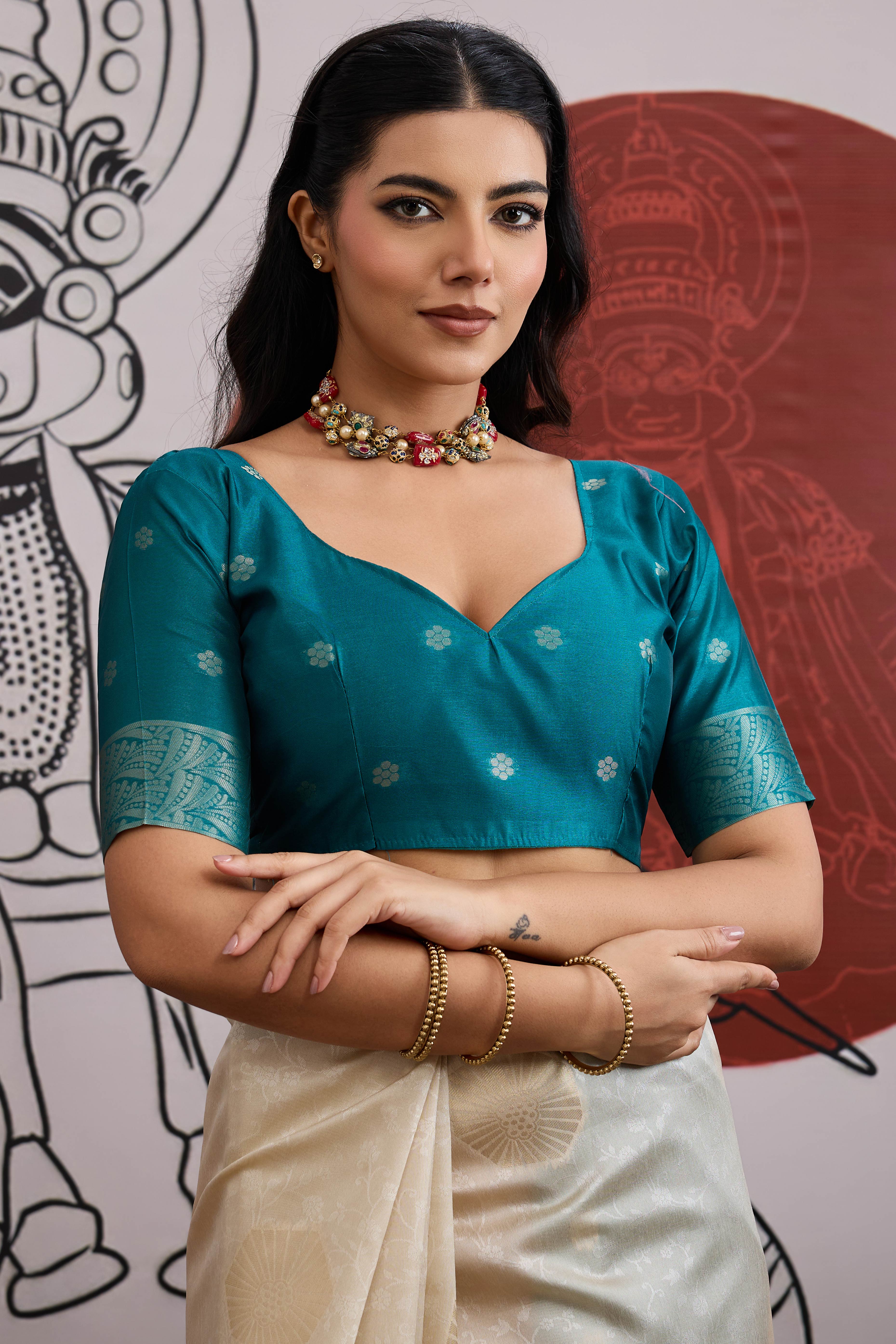 Graceful Cream & Teal Zari Weaving Silk Saree Highlighted By Decorative Tassel Pallu