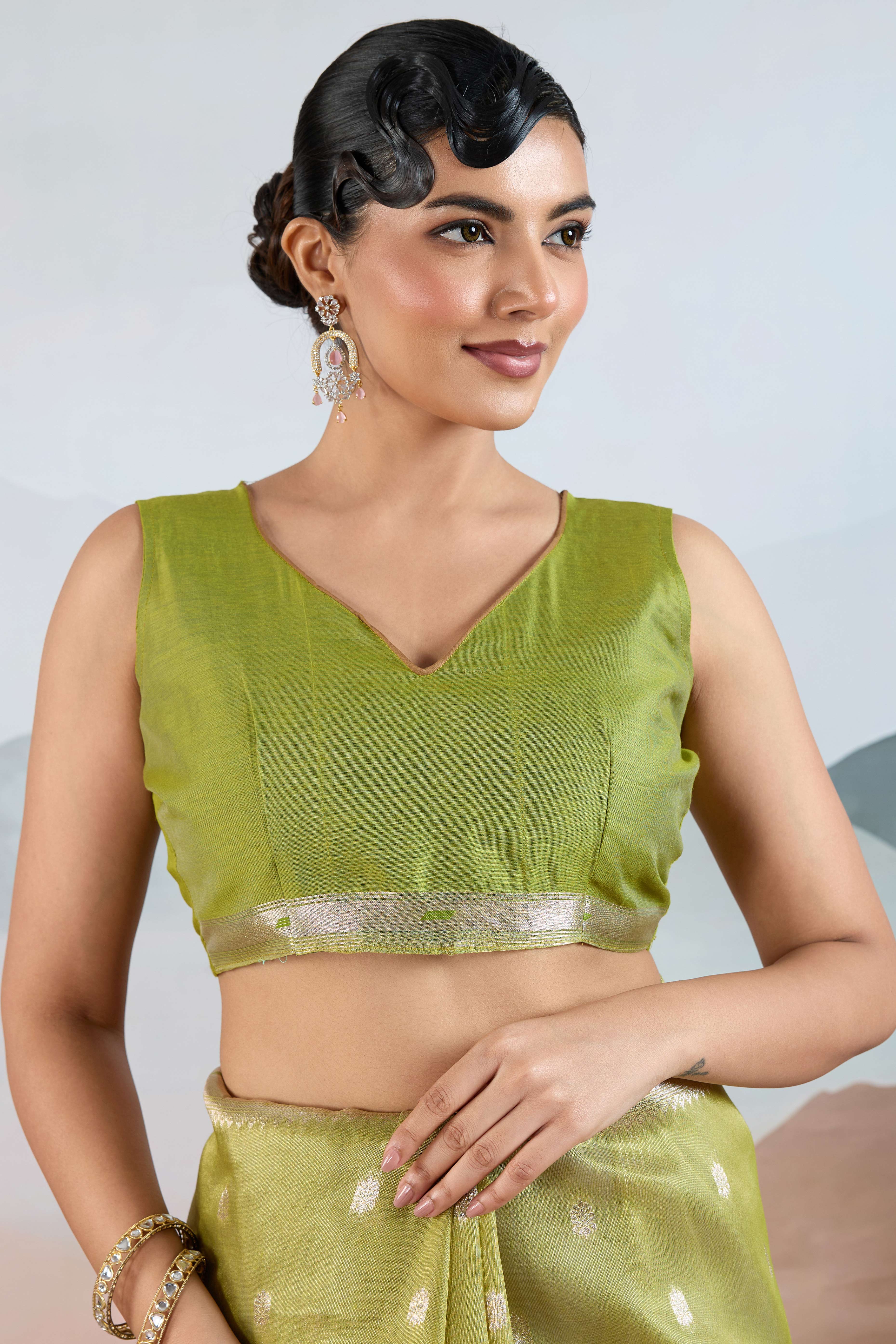 Green Festive Tissue Saree Crafted with Artistic Zari Butti Weaving and a Featherlight Texture