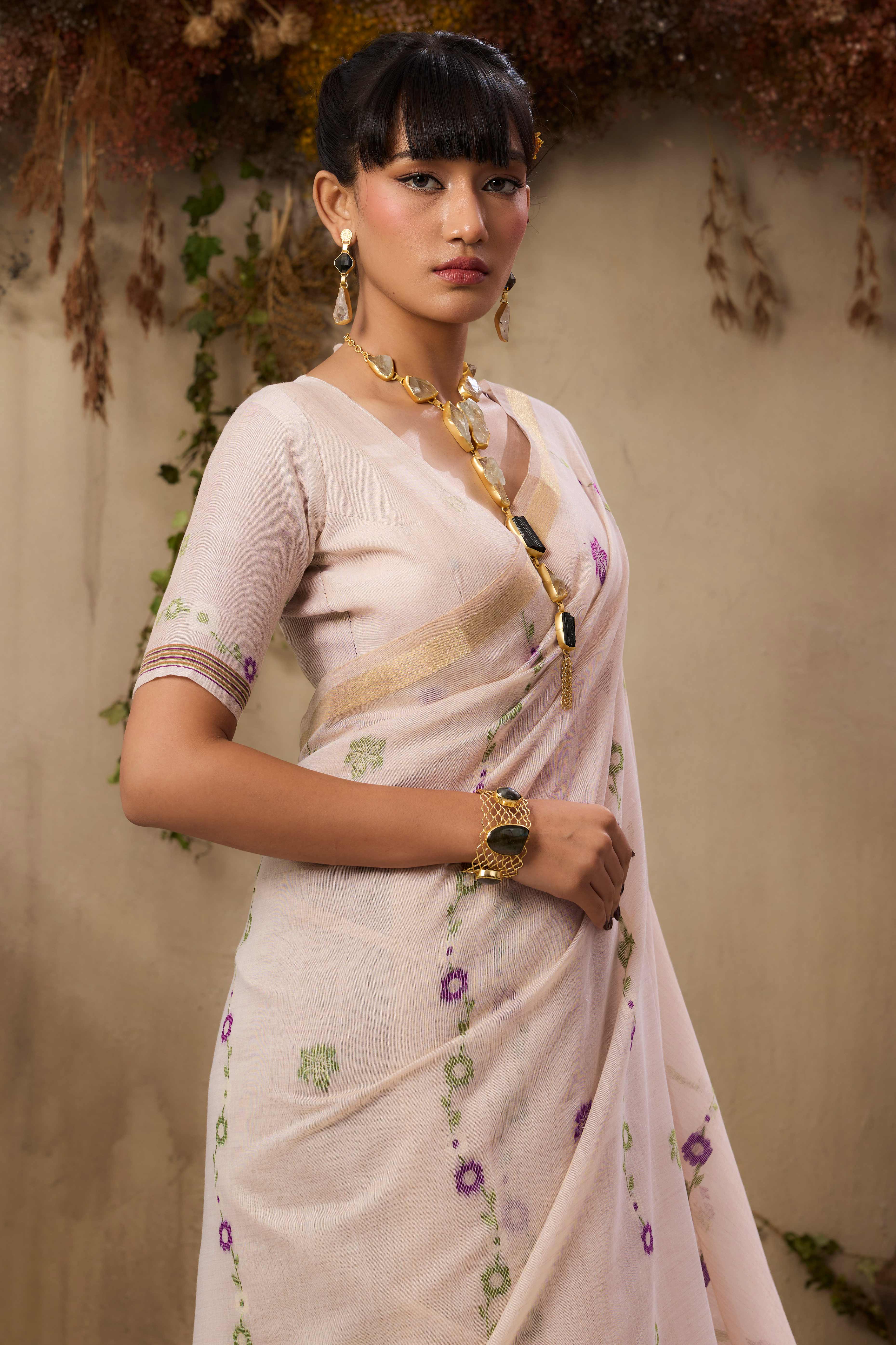 Cream Pure Munga Cotton Blend Saree Adorned with Intricate Floral Weaves
