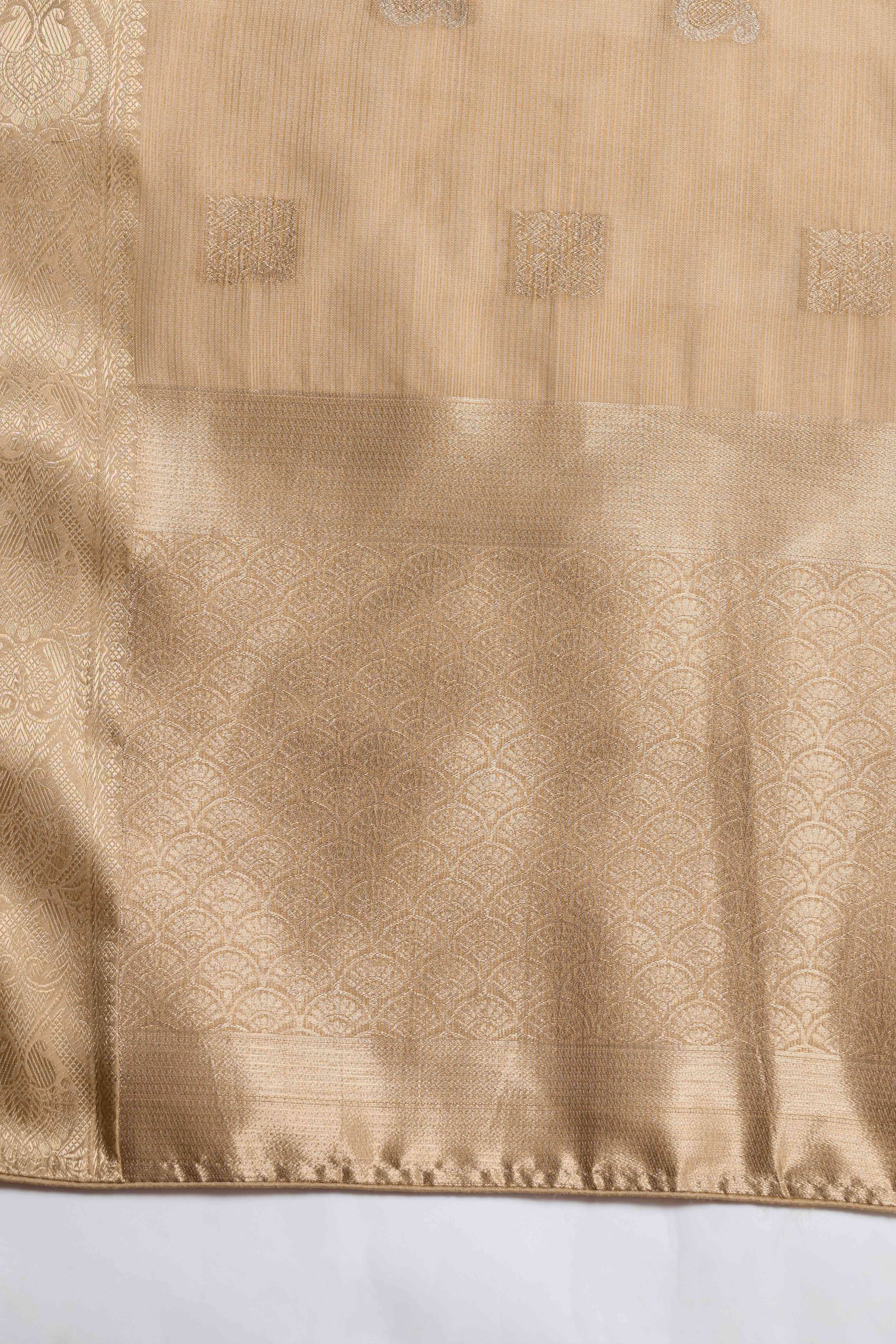 Contemporary Beige Silk Blend Saree Flaunting Alternate Butta With Piping & Tassel Accents