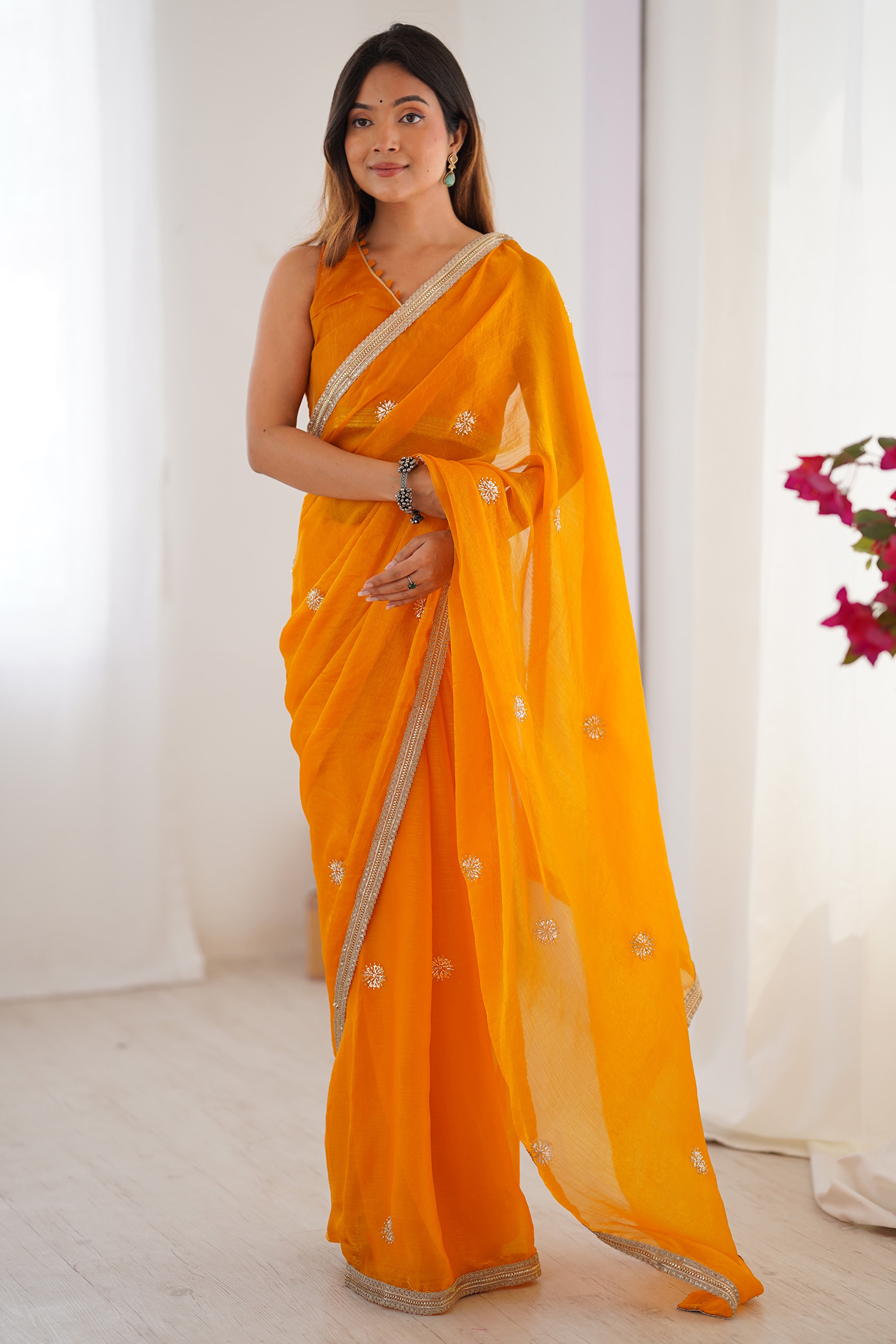 Elegant Mustard Yellow Organza Saree with Delicate Floral Embellishments and Lace Border