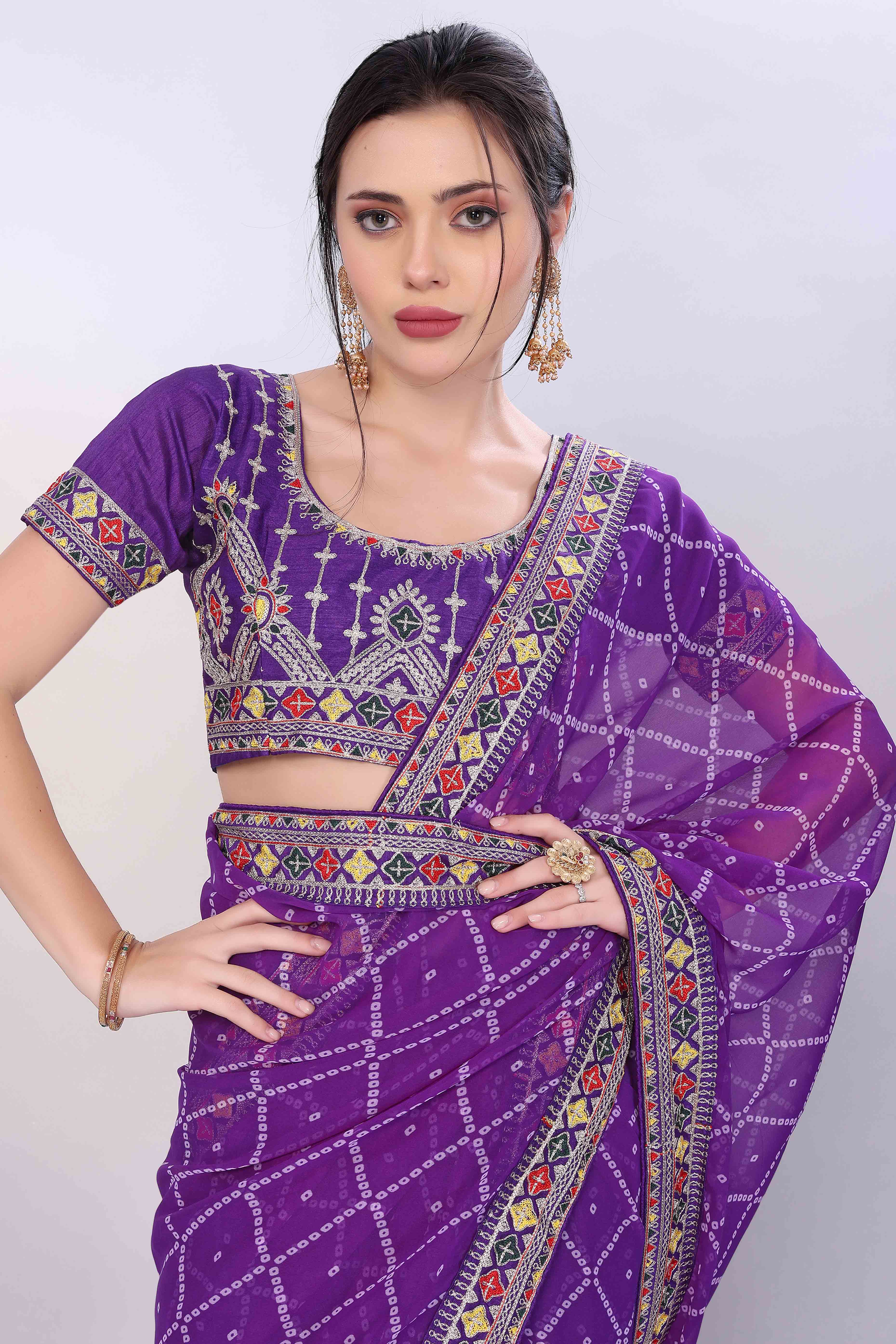 Purple Bandhani Printed Georgette Saree Framed With Elegant Embroidered Border