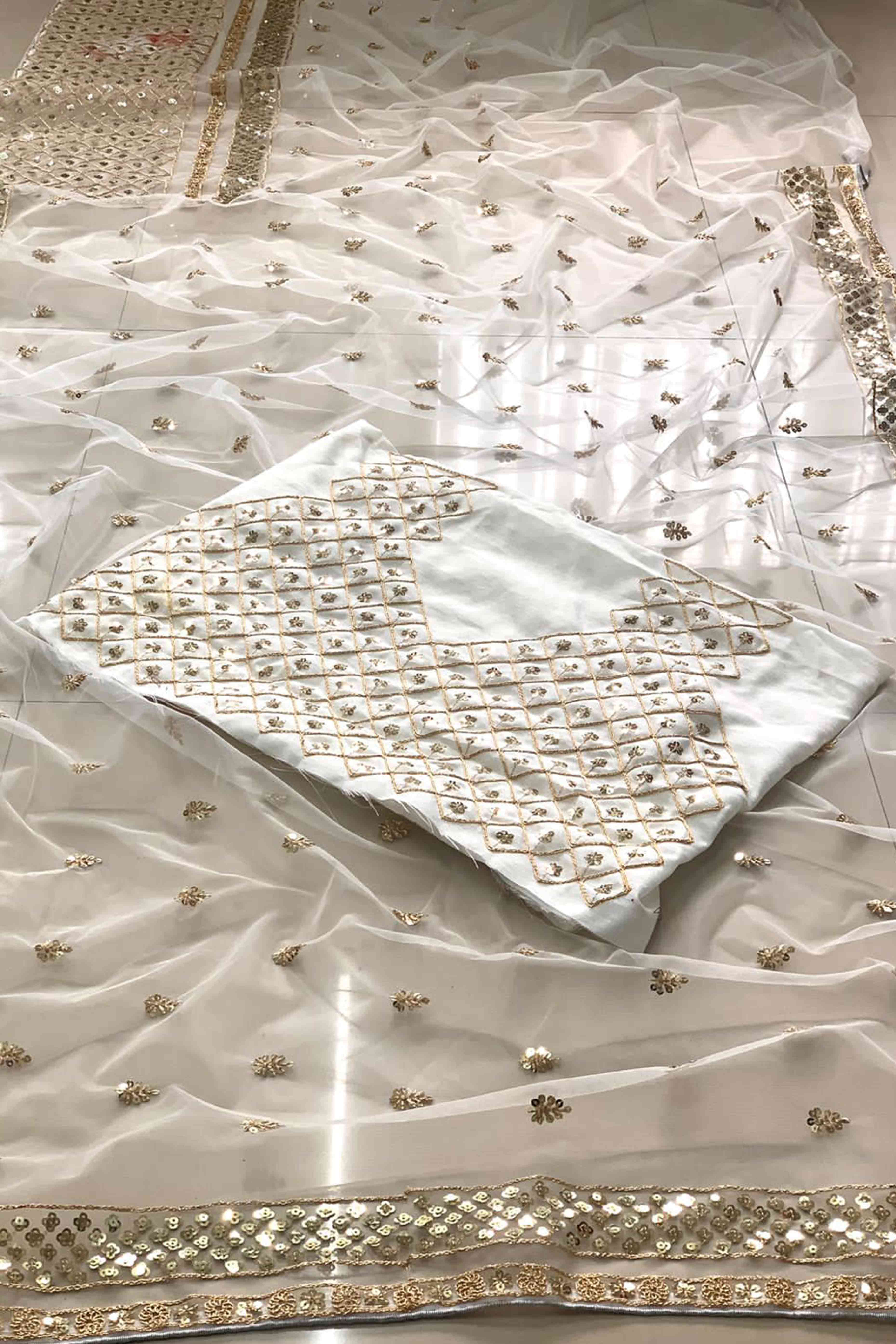 Graceful Off White Sequins Embellished Net Saree for Partywear