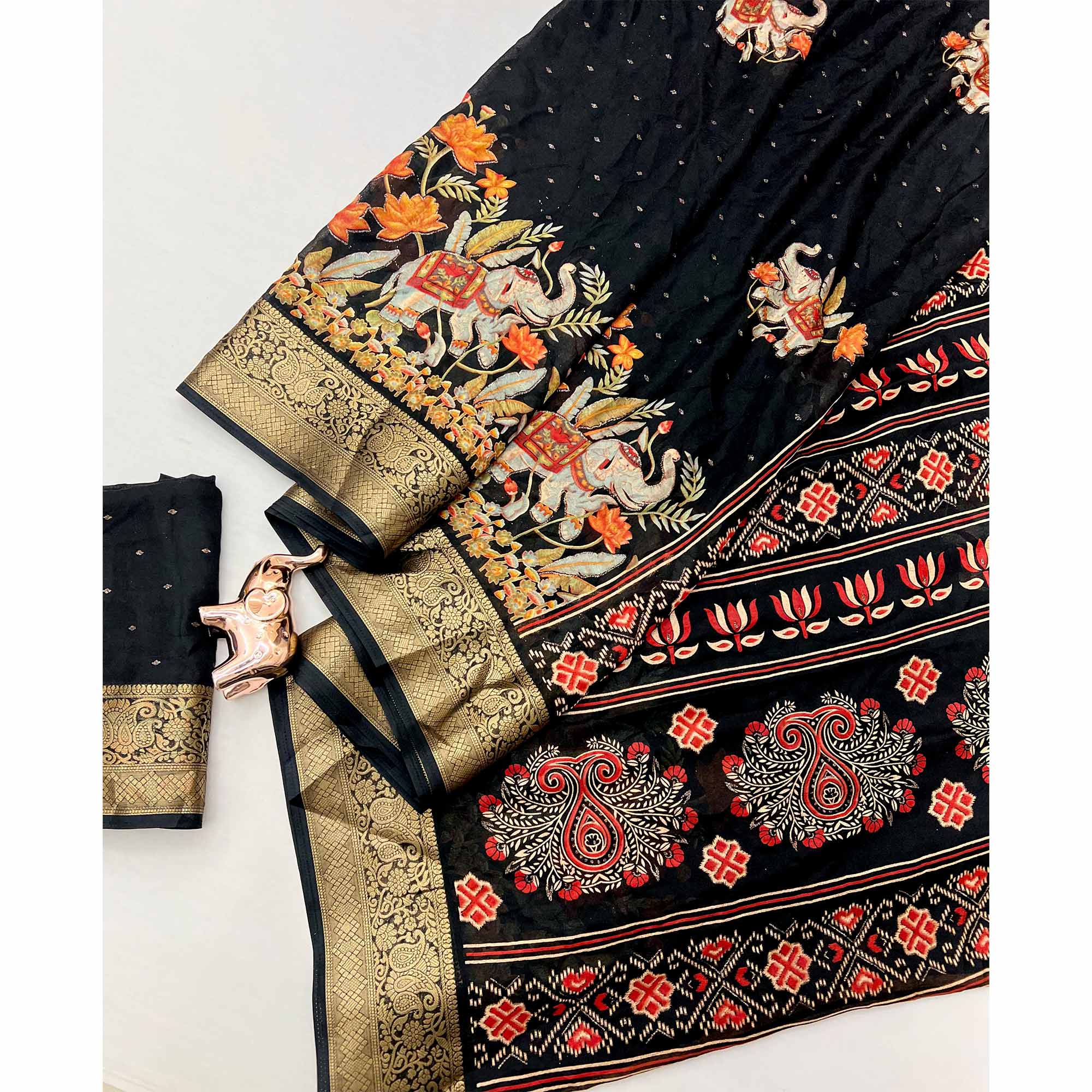 Elegant Black Elephant & Floral Printed Georgette Saree Accented With Gleaming Weaving Zari Border