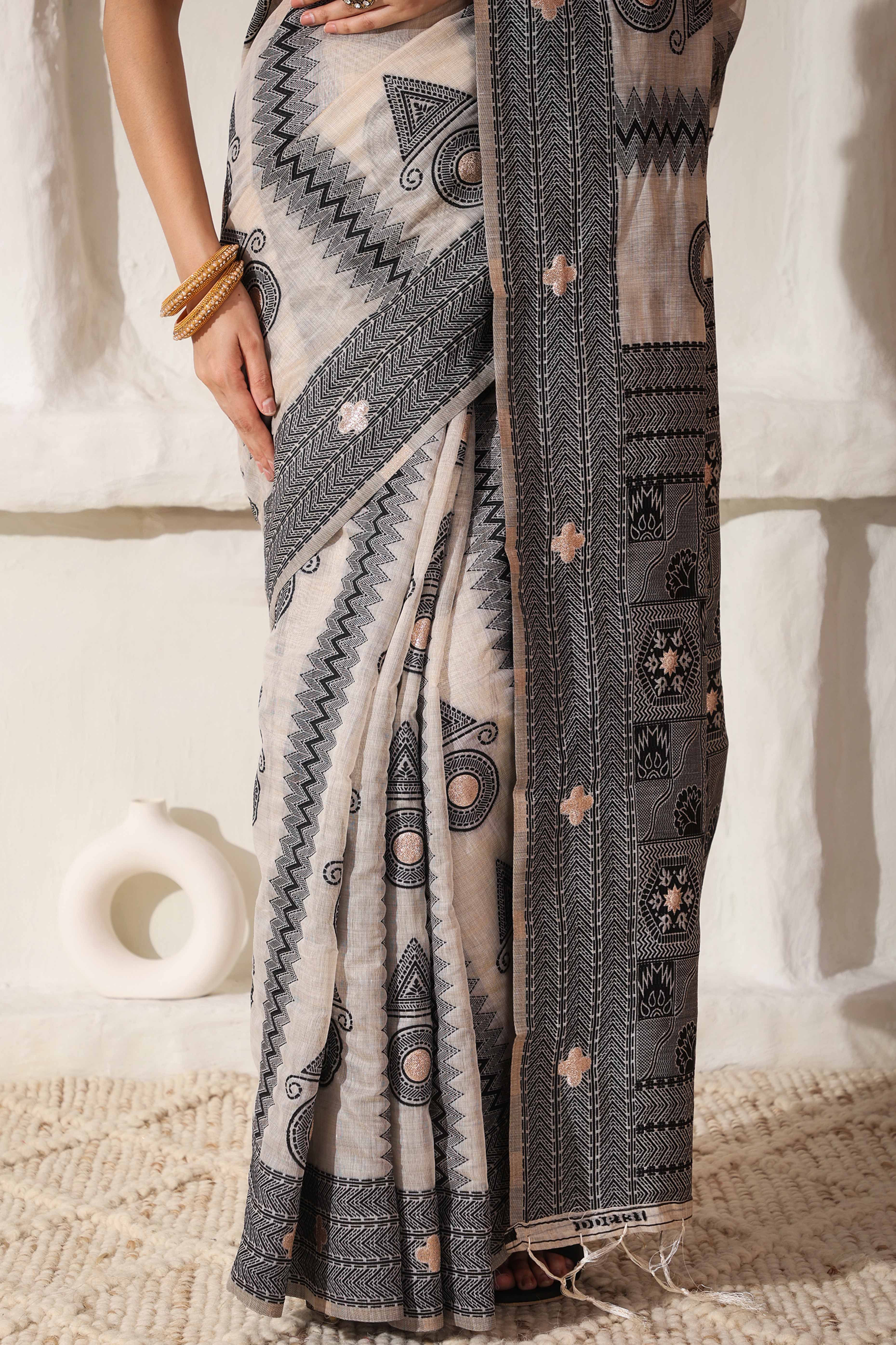 Elegant Zari Weaving Work On Cream & Black Linen Cotton Saree With Tassel Finish