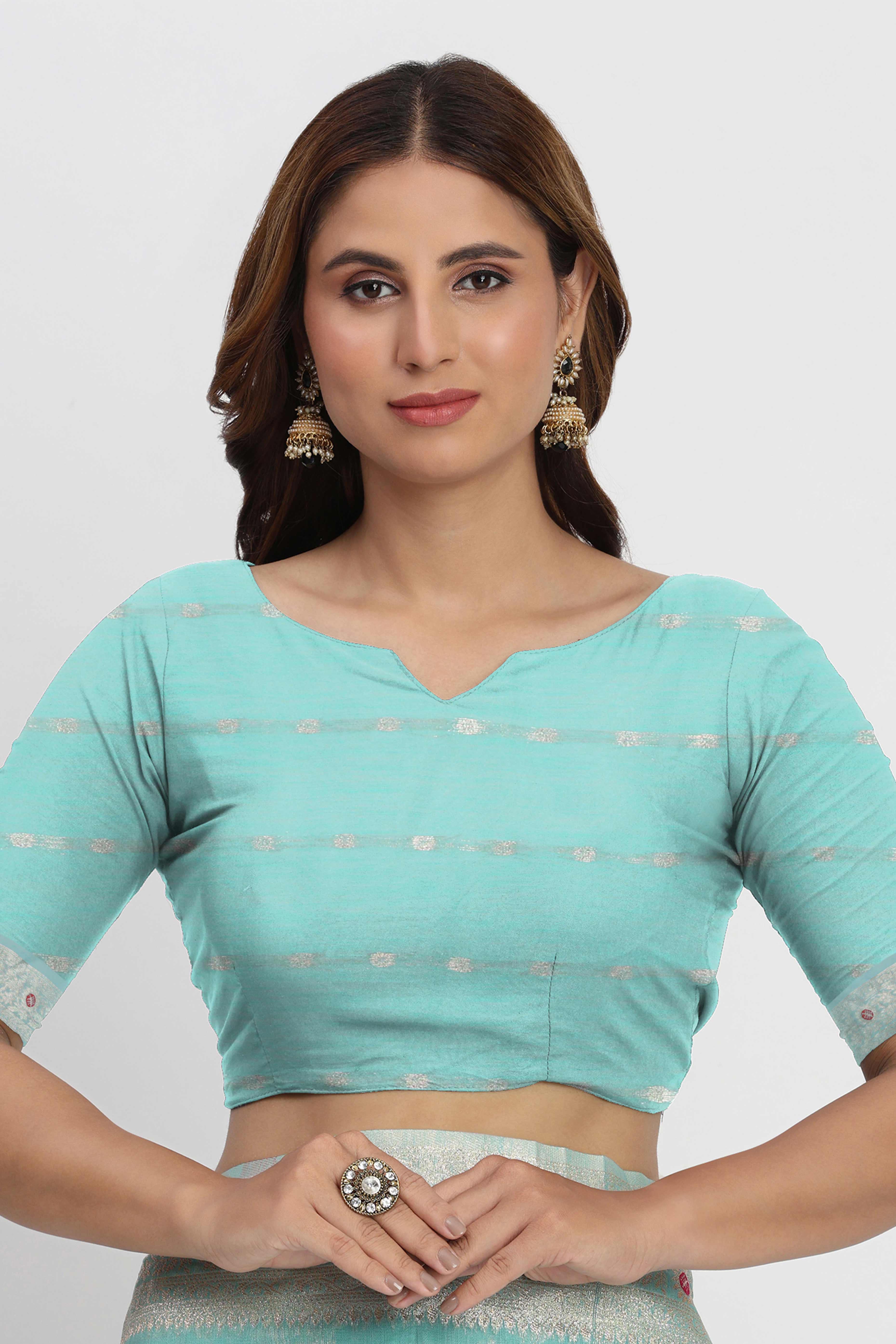 Floral Zari Weaving Brings Regal Beauty To This Turquoise Linen Cotton Saree With Tassel Accents