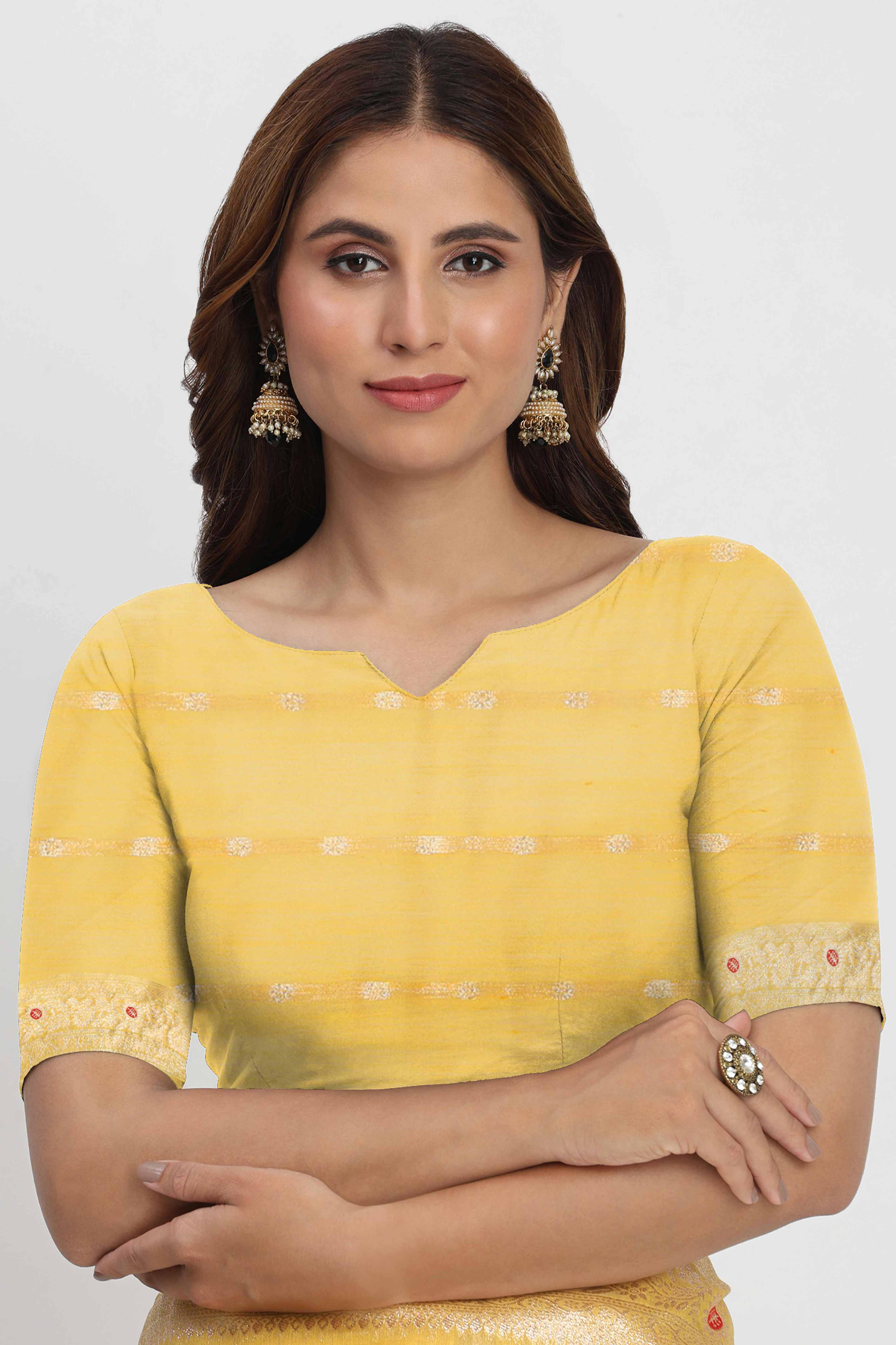 Floral Zari Weaving Brings Regal Beauty To This Yellow Linen Cotton Saree With Tassel Accents