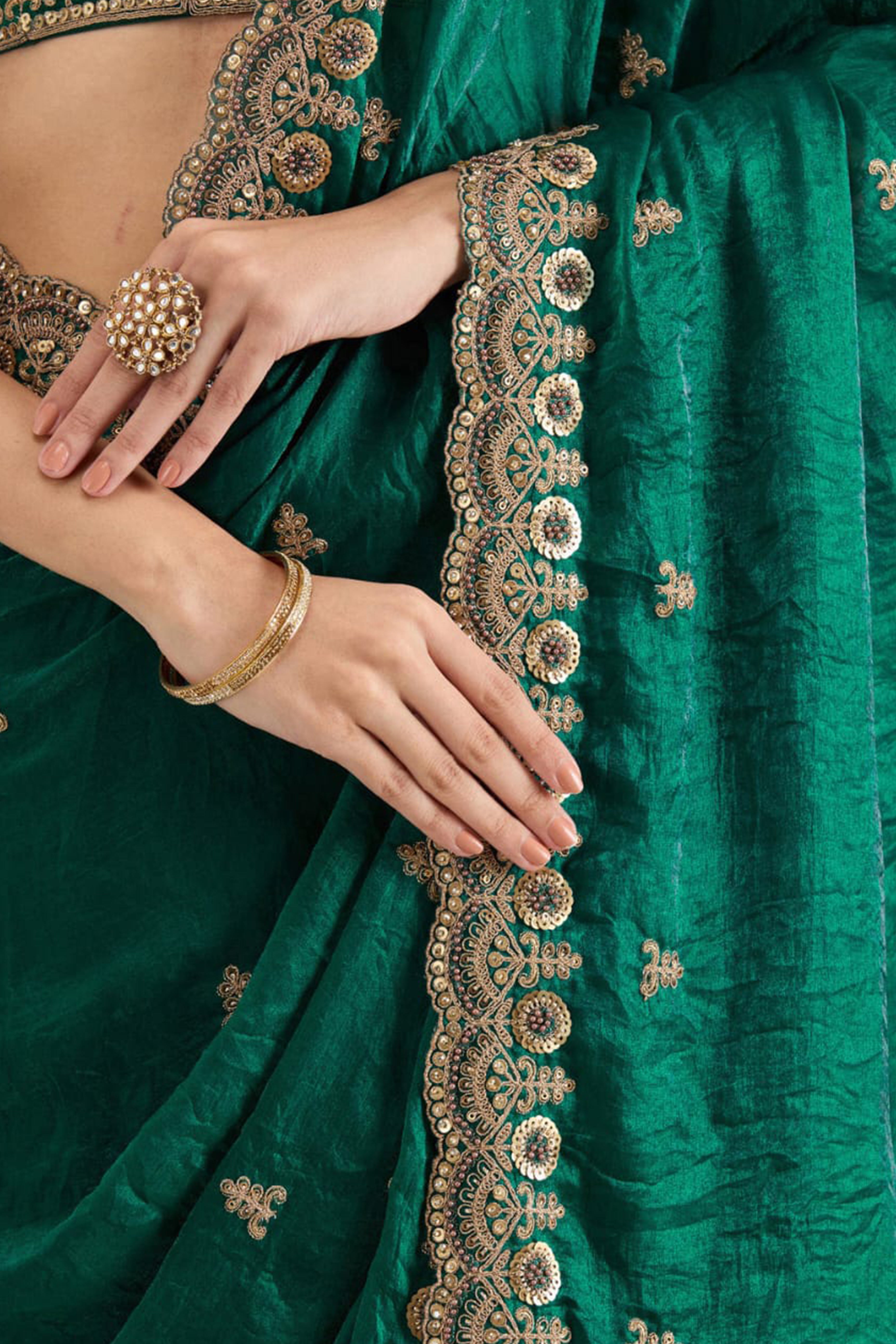 Trendy Green Fancy Satin Saree Enhanced With Rich Golden Embroidered Design