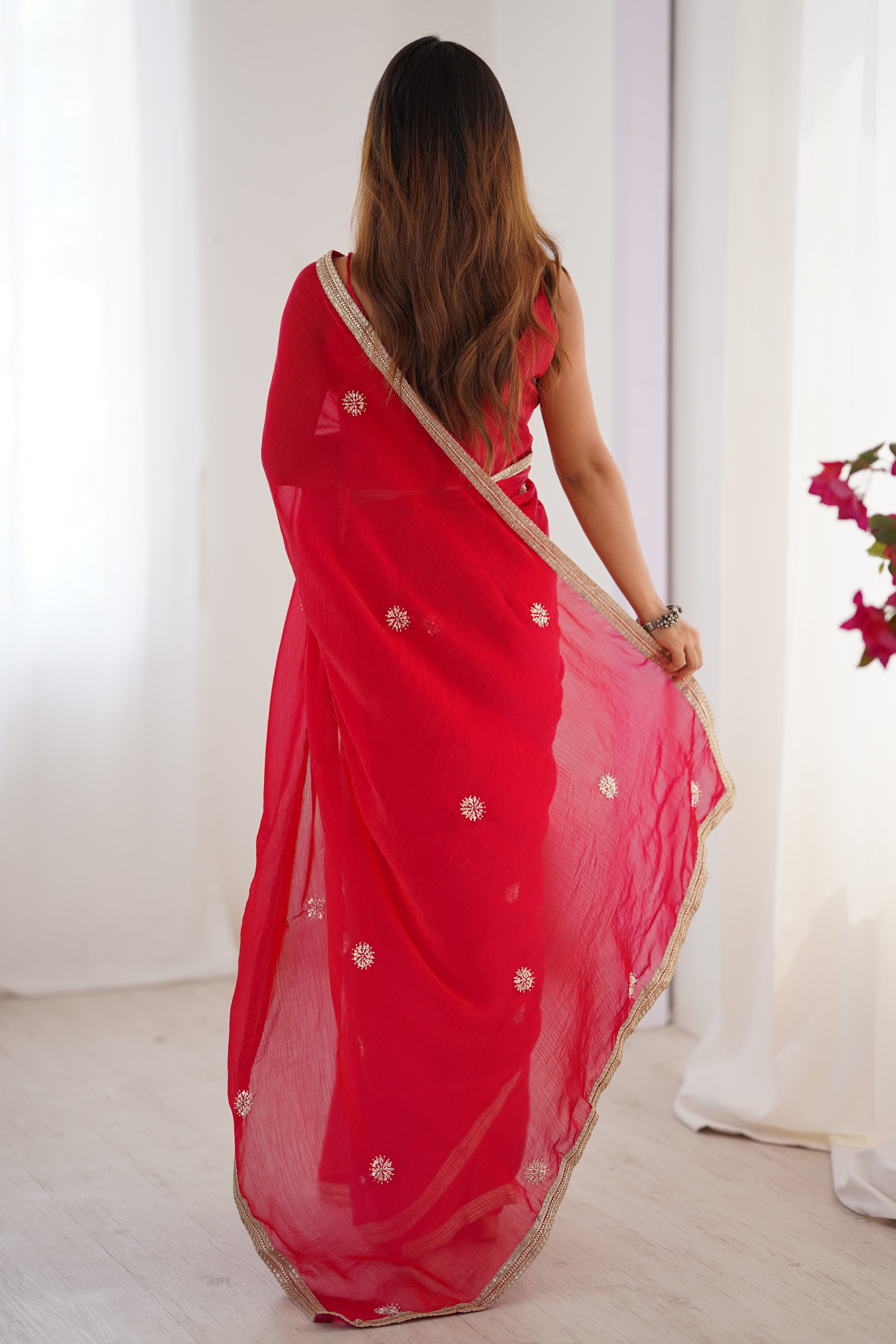 Elegant Red Organza Saree with Delicate Floral Embellishments and Lace Border