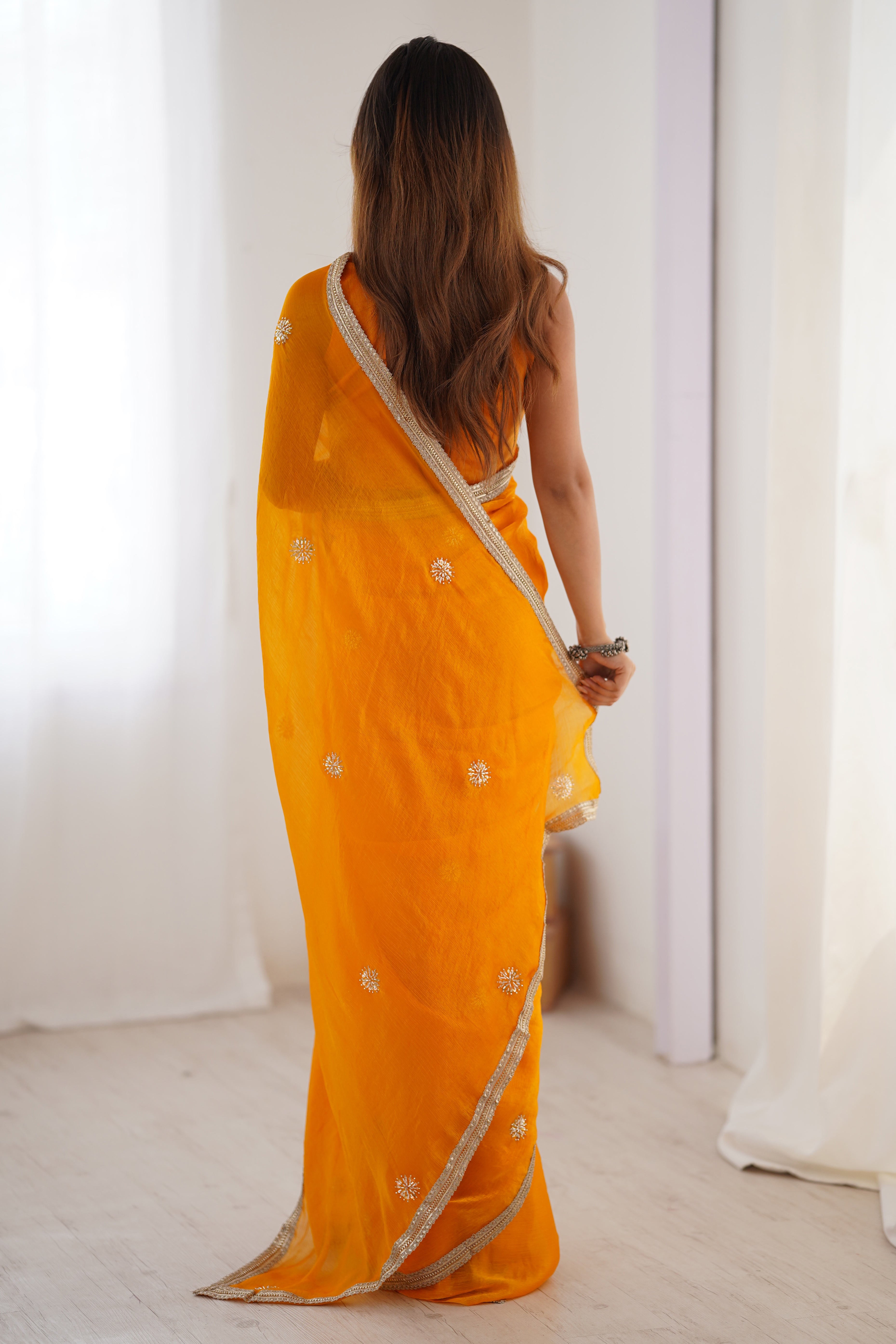 Elegant Mustard Yellow Organza Saree with Delicate Floral Embellishments and Lace Border