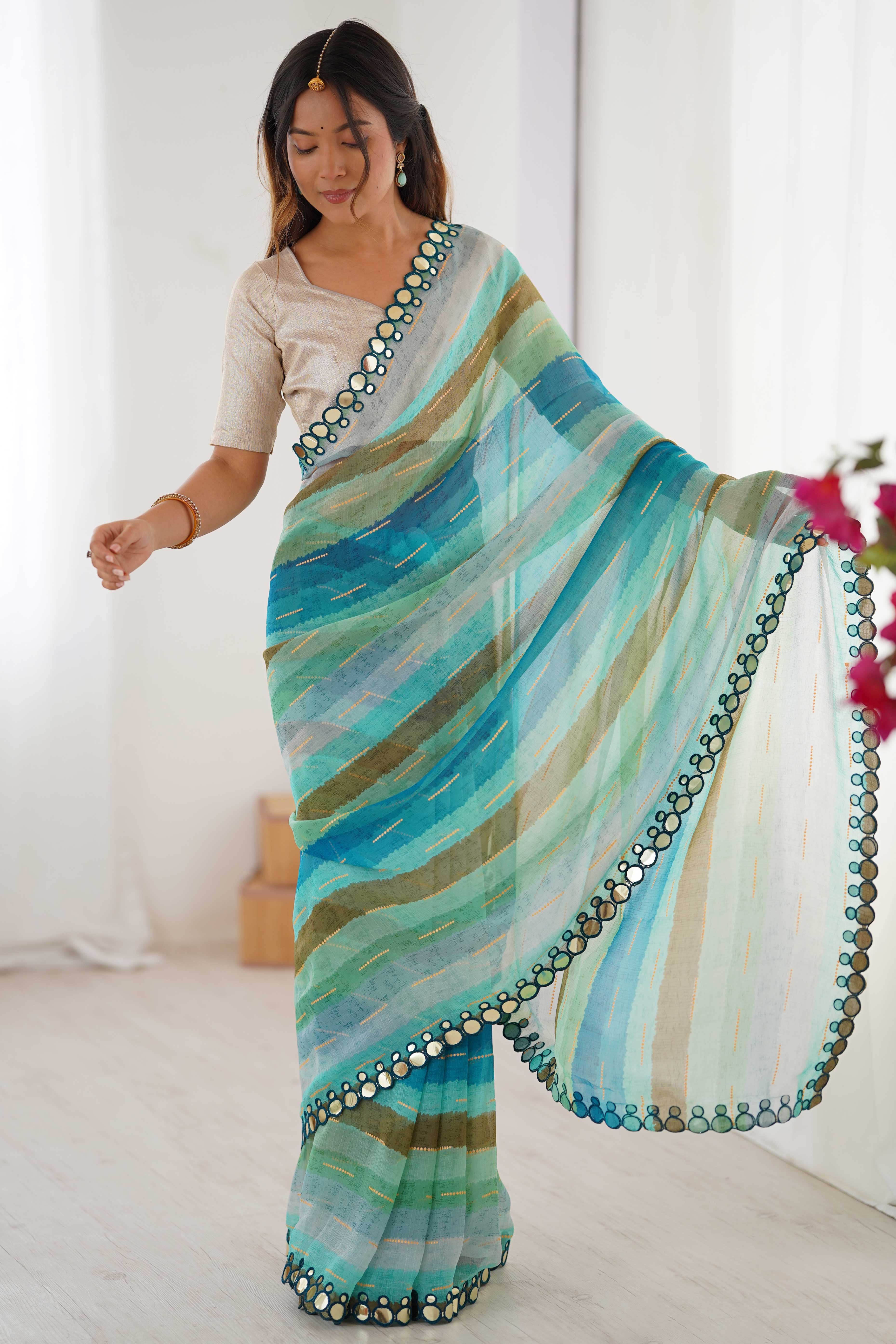 Soft Chiffon Turquoise Saree Featuring Classic Leheriya and Mirror Work Edges
