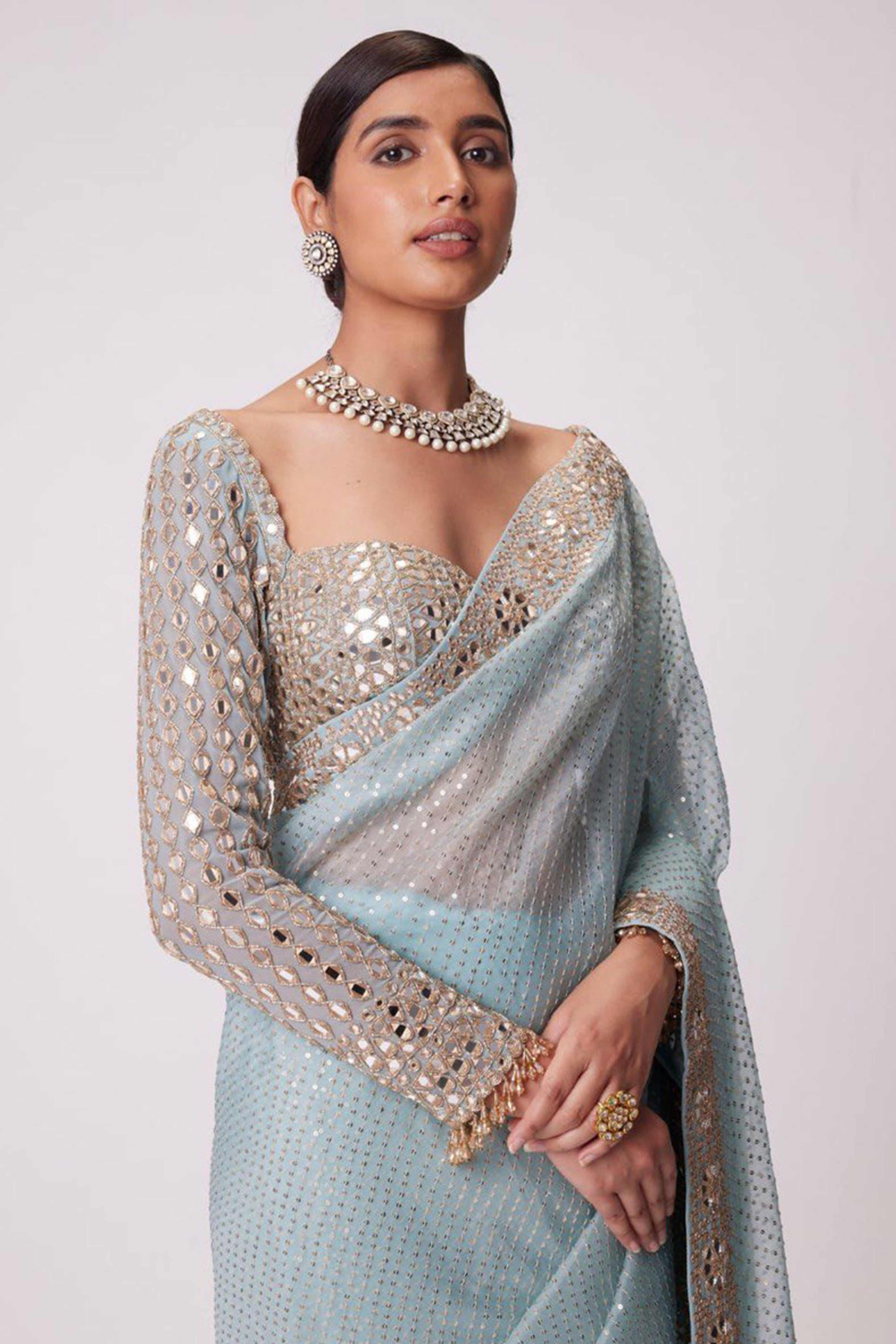 Sky Blue Faux Georgette Saree Adorned with Sequins Work and Elegant Embellishments