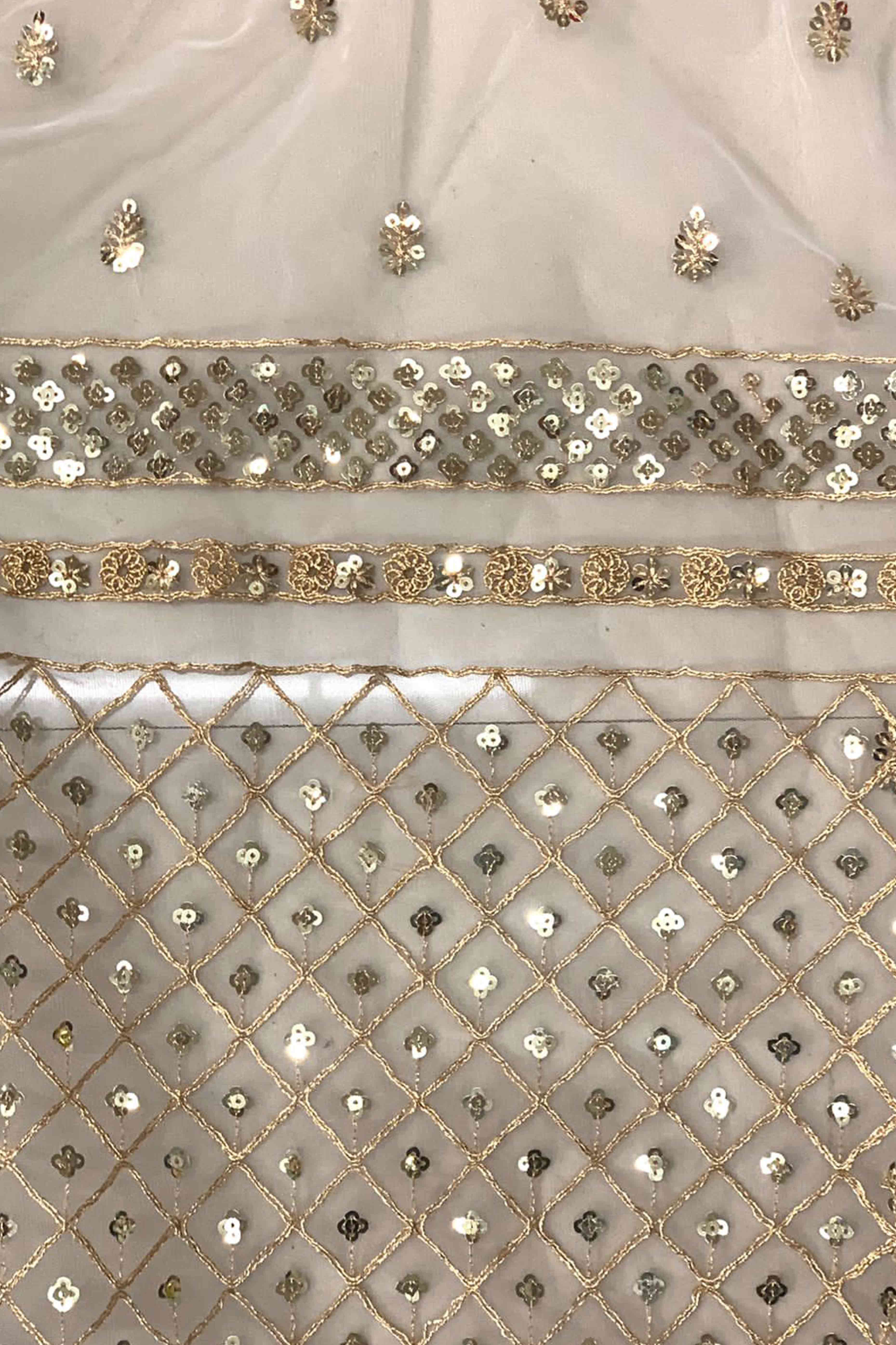 Graceful Off White Sequins Embellished Net Saree for Partywear