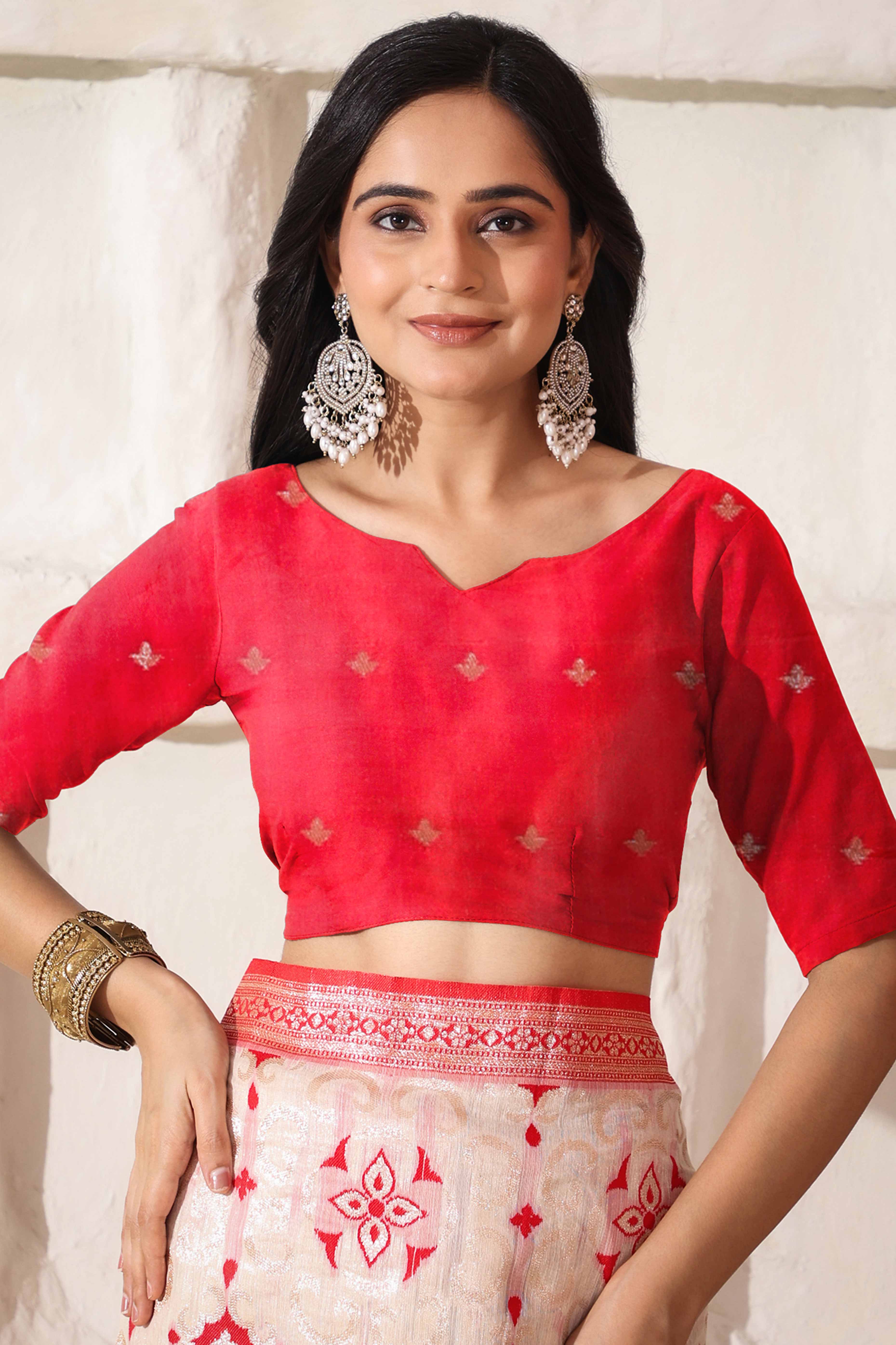 White & Red Linen Cotton Saree Adorned With Intricate Zari Weaving And Tassel Pallu