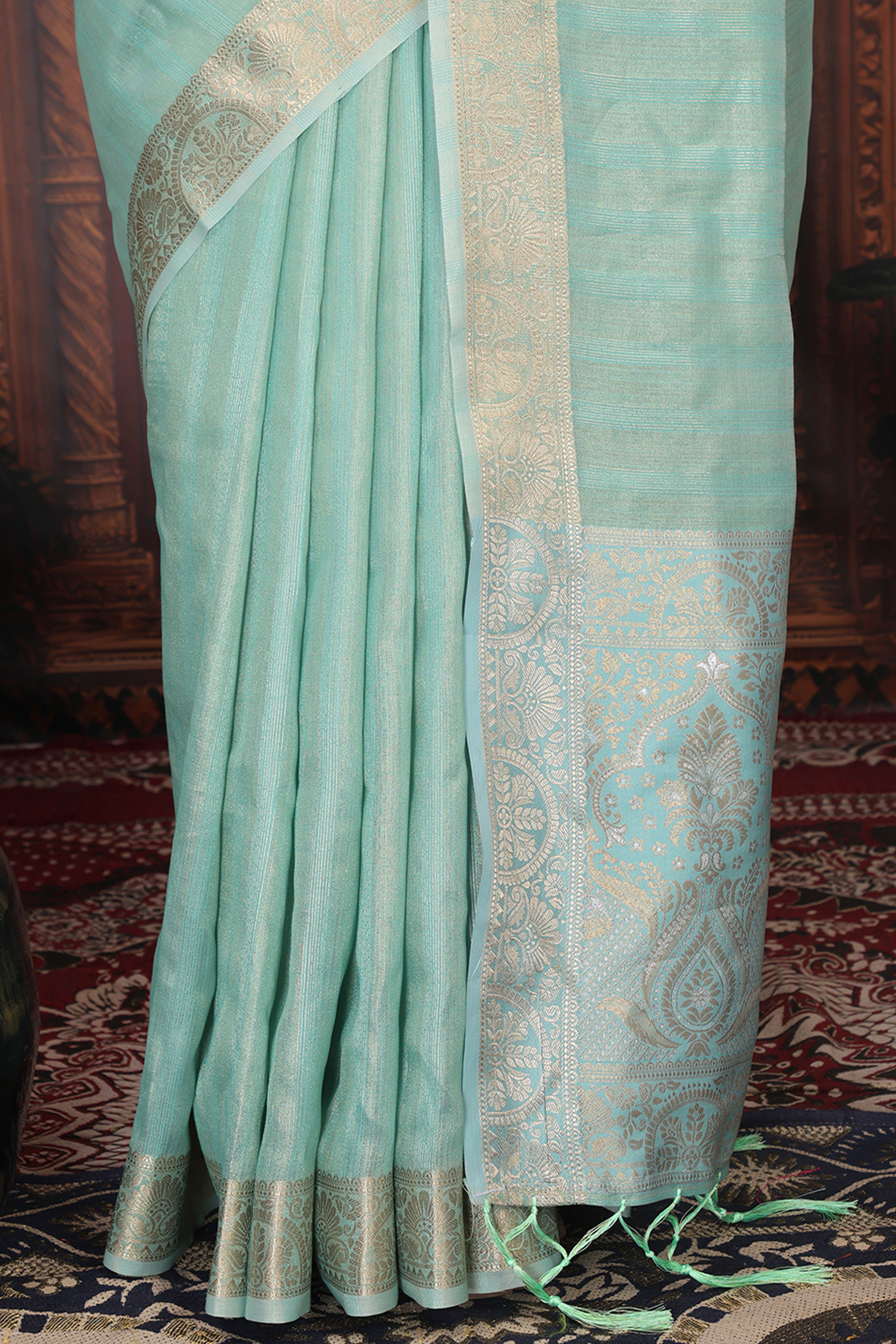 Turquoise Organza Saree Adorned With Floral Zari Weaving & Graceful Tassel Pallu