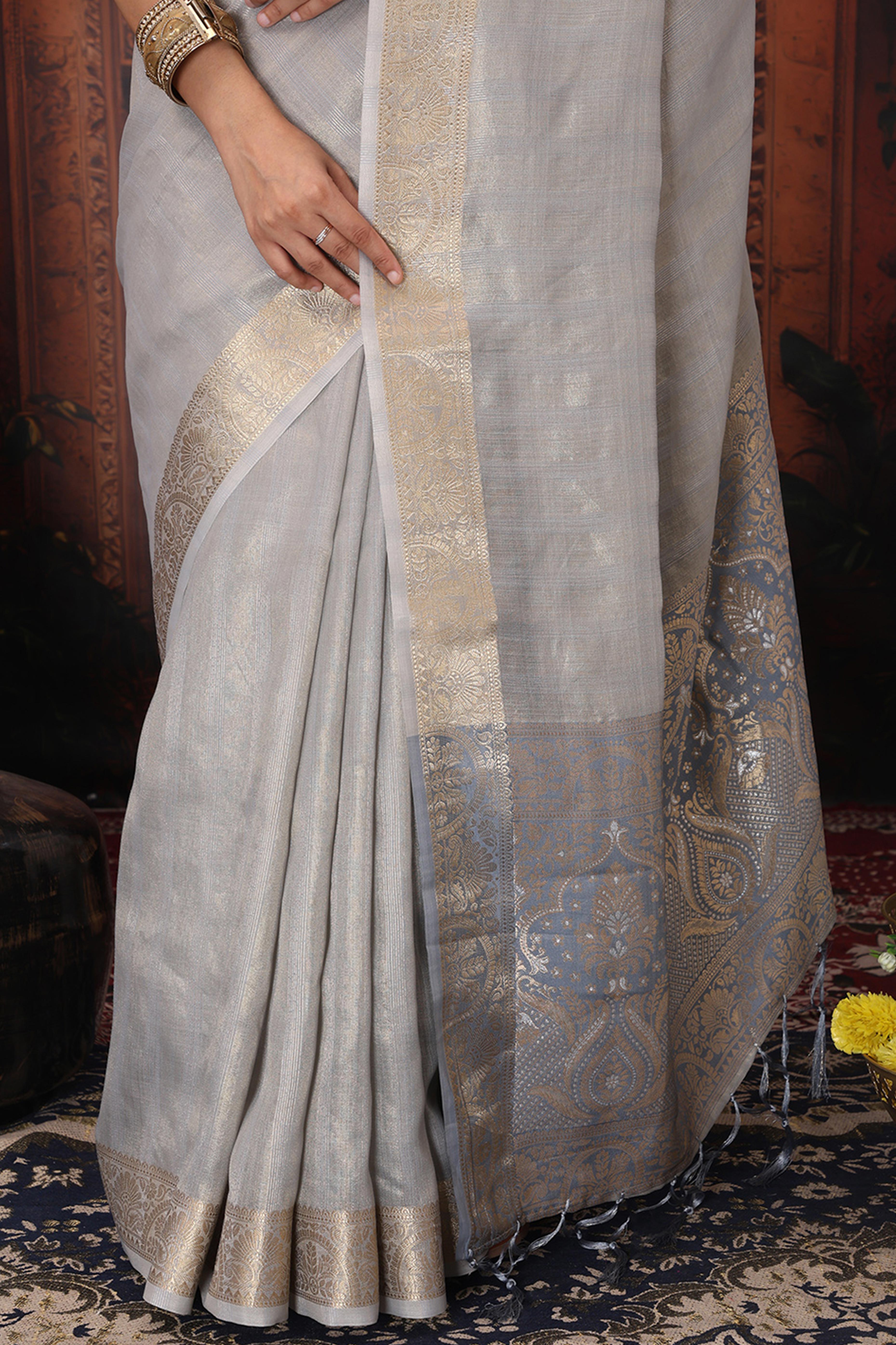 Grey Organza Saree Adorned With Floral Zari Weaving & Graceful Tassel Pallu