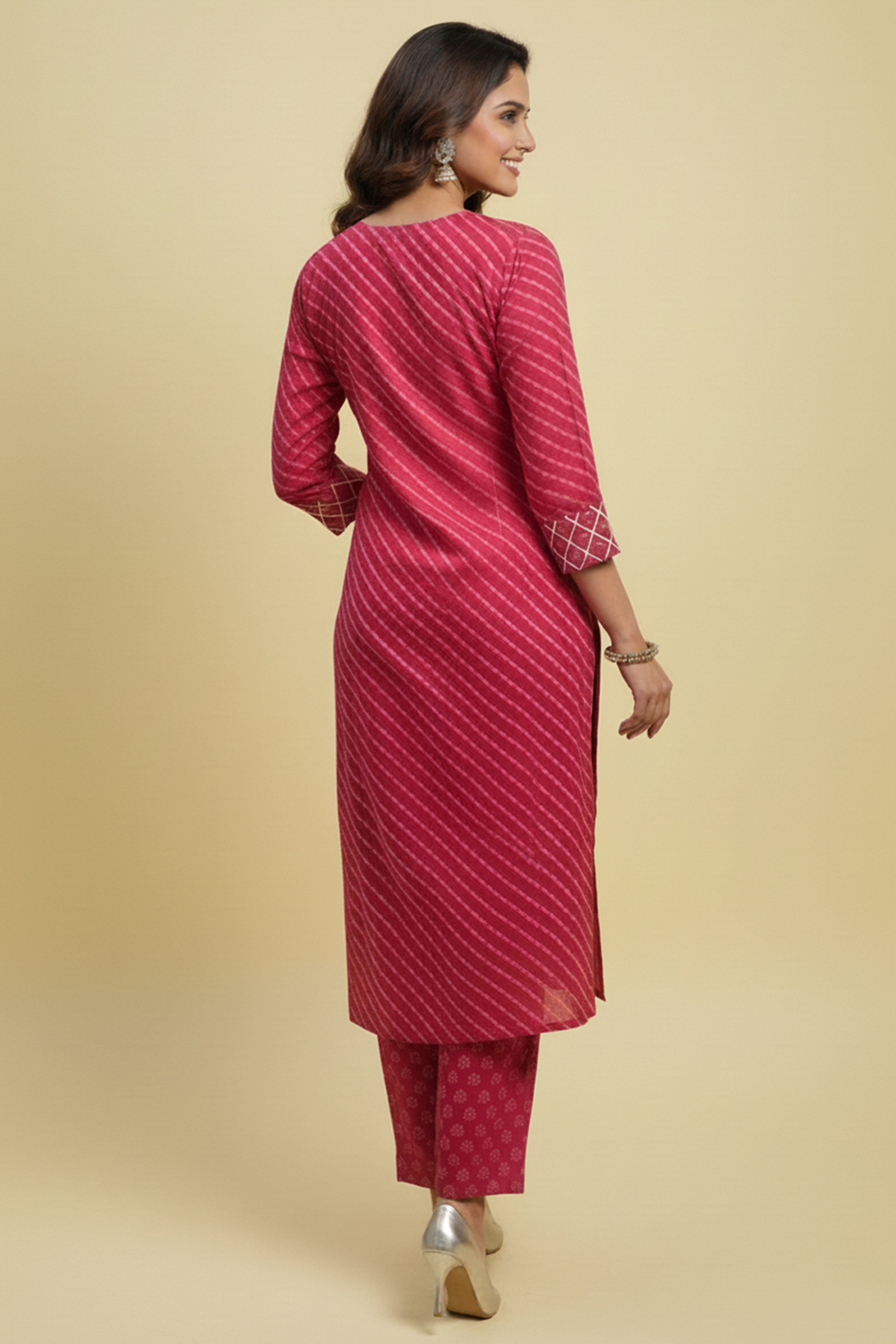 Graceful Pink Cotton Salwar Suit Highlighted with Leheriya Print and Thread Detailing