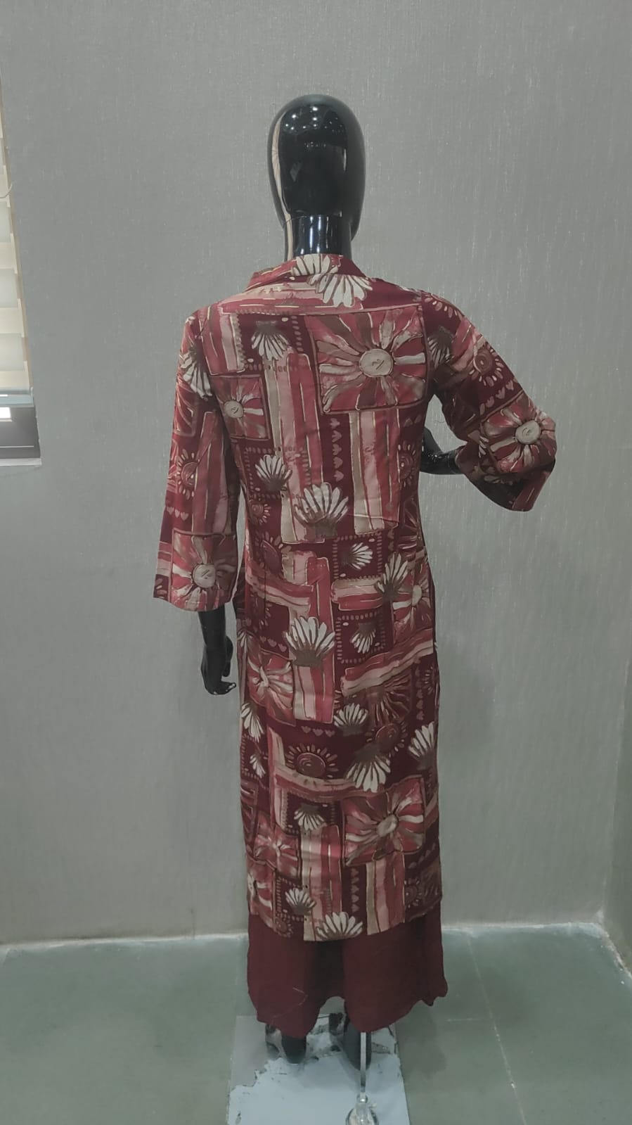 Elegant Maroon Floral Printed Straight Cut Salwar Suit Adorned With Mirror & Sequin On The Neckline - Model View 1