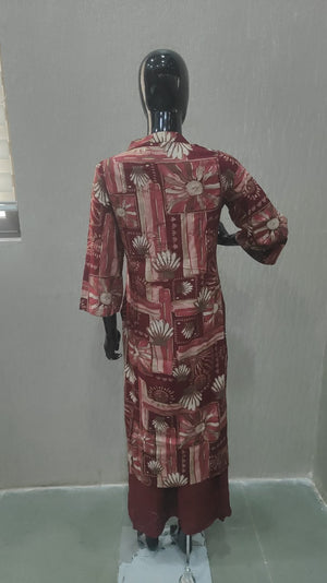 Elegant Maroon Floral Printed Straight Cut Salwar Suit Adorned With Mirror & Sequin On The Neckline - Model View 1