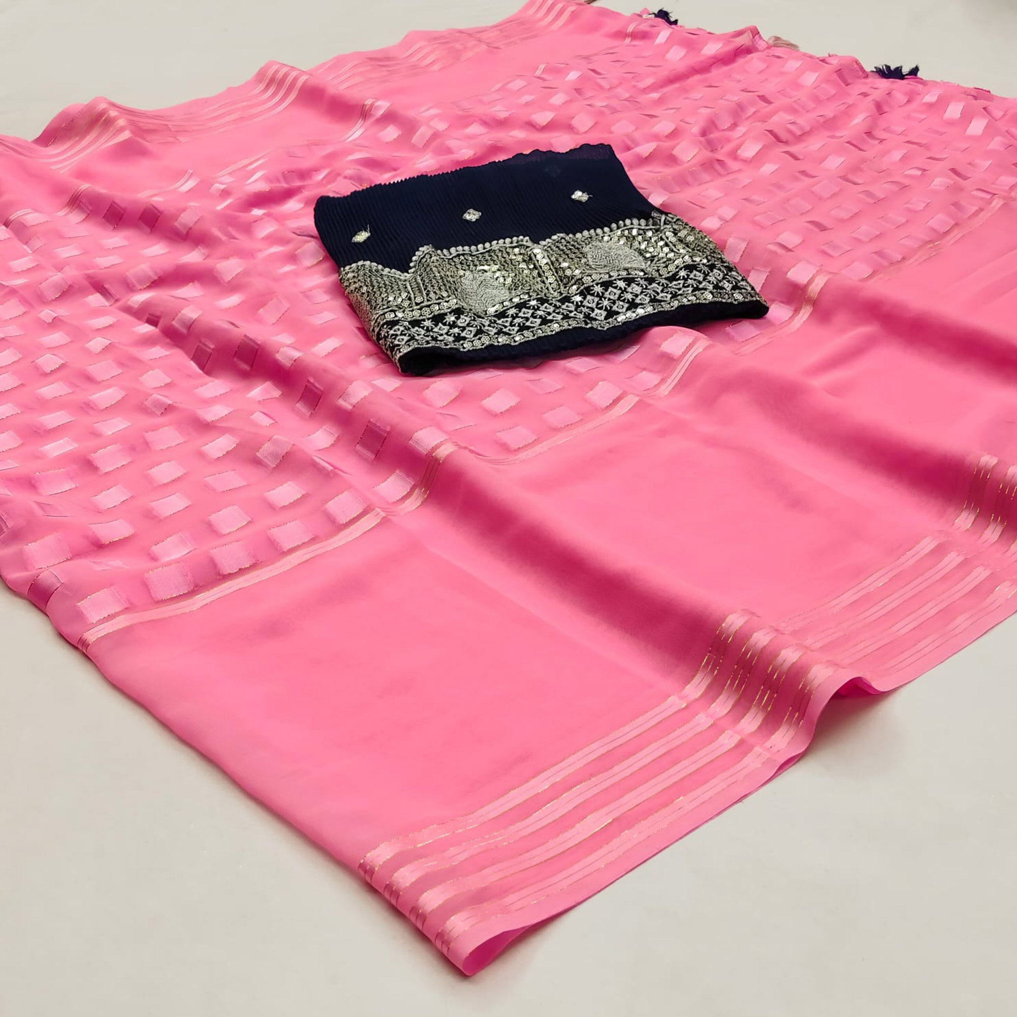 Pink Woven Georgette Saree With Tassels