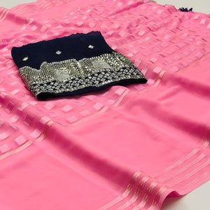 Pink Woven Georgette Saree With Tassels