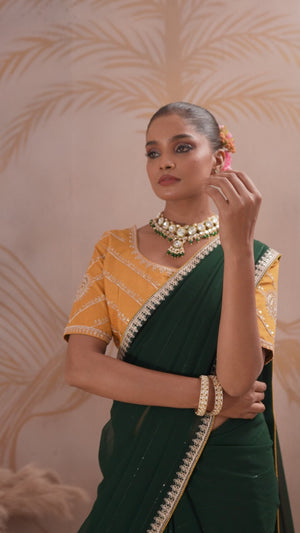 Green Zari Embroidered Georgette Saree Accented With Sequins
