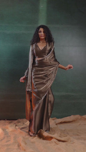 Dark Brown Solid Tissue Chiffon Saree Accentuated With A Sparkling Zarkan Work Border