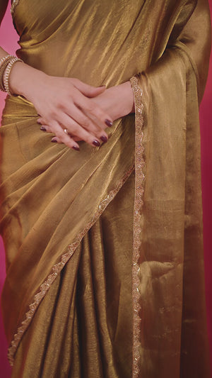 Party Wear Gold Chiffon Solid Saree with Delicate Border Embellishment