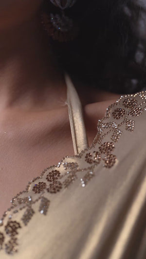 Beige Satin Georgette Saree Adorned With Subtle Foil Finish & A Sparkling Zarkan Work Border