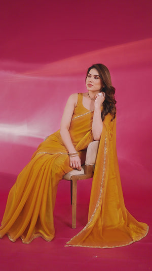 Party Wear Mustard Chiffon Solid Saree with Delicate Border Embellishment