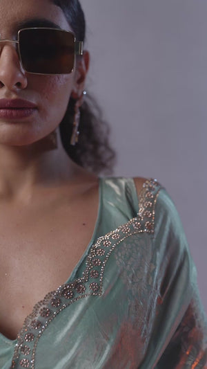 Turquoise Satin Silk Saree Showcasing Elegant Floral Foil Prints & Dazzling Zarkan Work