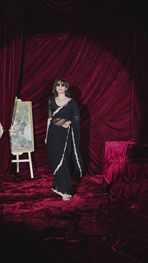 Glamorous Black Solid Georgette Saree Featuring Embellished Stone Border Work