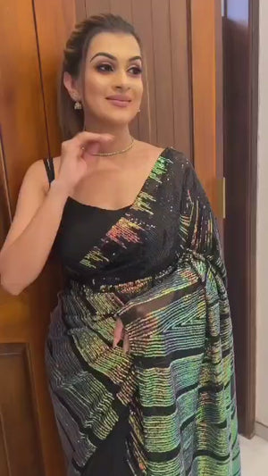 Stunning Black Georgette Partywear Saree Adorned with All-Over Sequin Embellishments