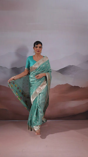 Turquoise Festive Tissue Saree Crafted with Artistic Zari Butti Weaving and a Featherlight Texture