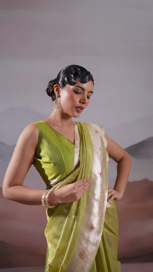Green Festive Tissue Saree Crafted with Artistic Zari Butti Weaving and a Featherlight Texture